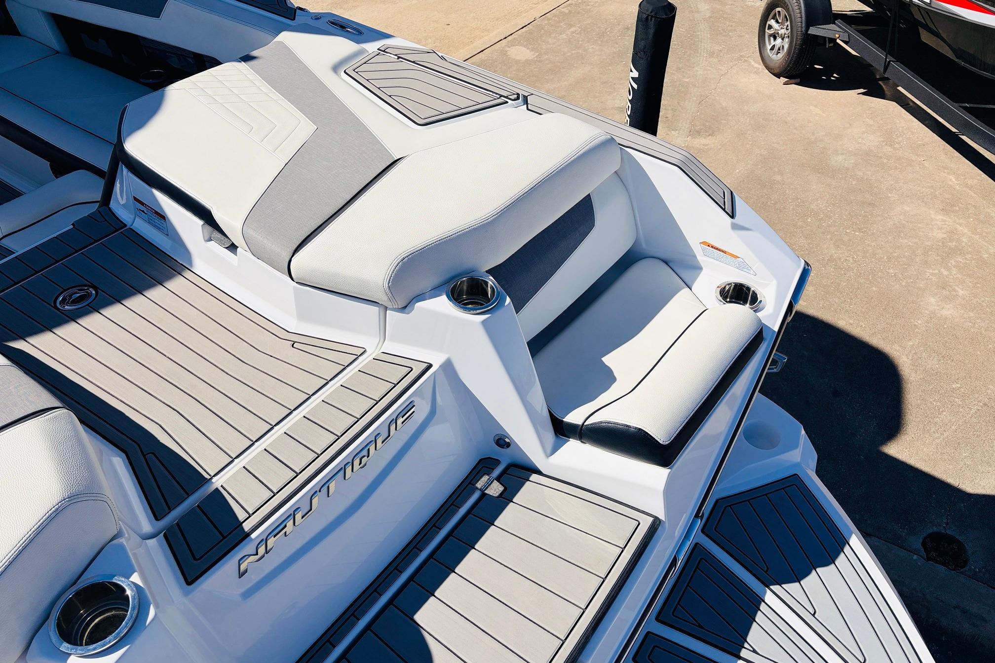 2023 Nautique Super Air Nautique G25 boat interior with sleek seating and cup holders.