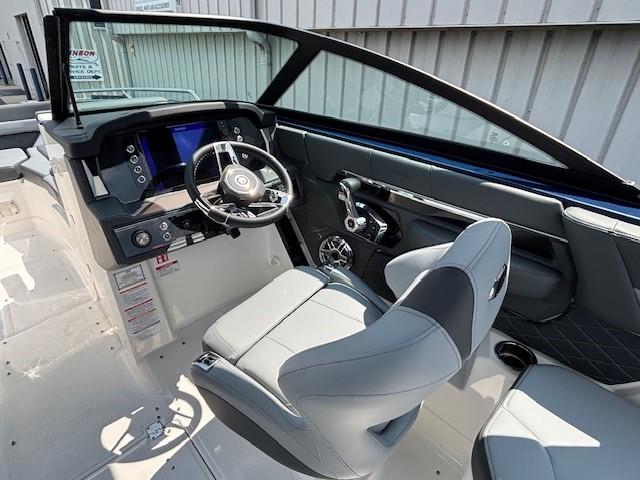 2026 Chaparral SSX 6 boat interior with modern dashboard and steering wheel.
