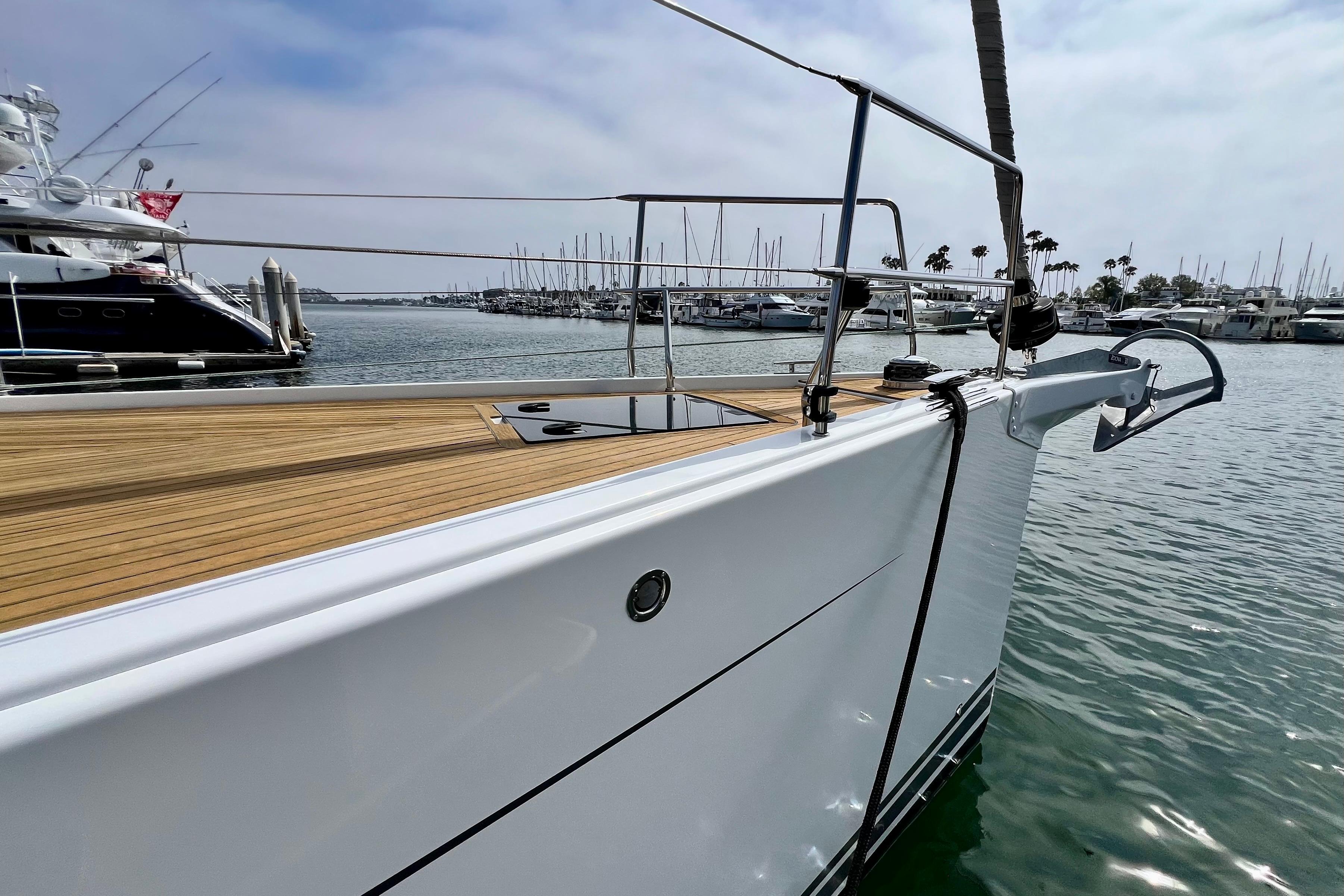 Sleek 2016 Hanse 455 yacht docked in a marina, showcasing elegant design and craftsmanship.