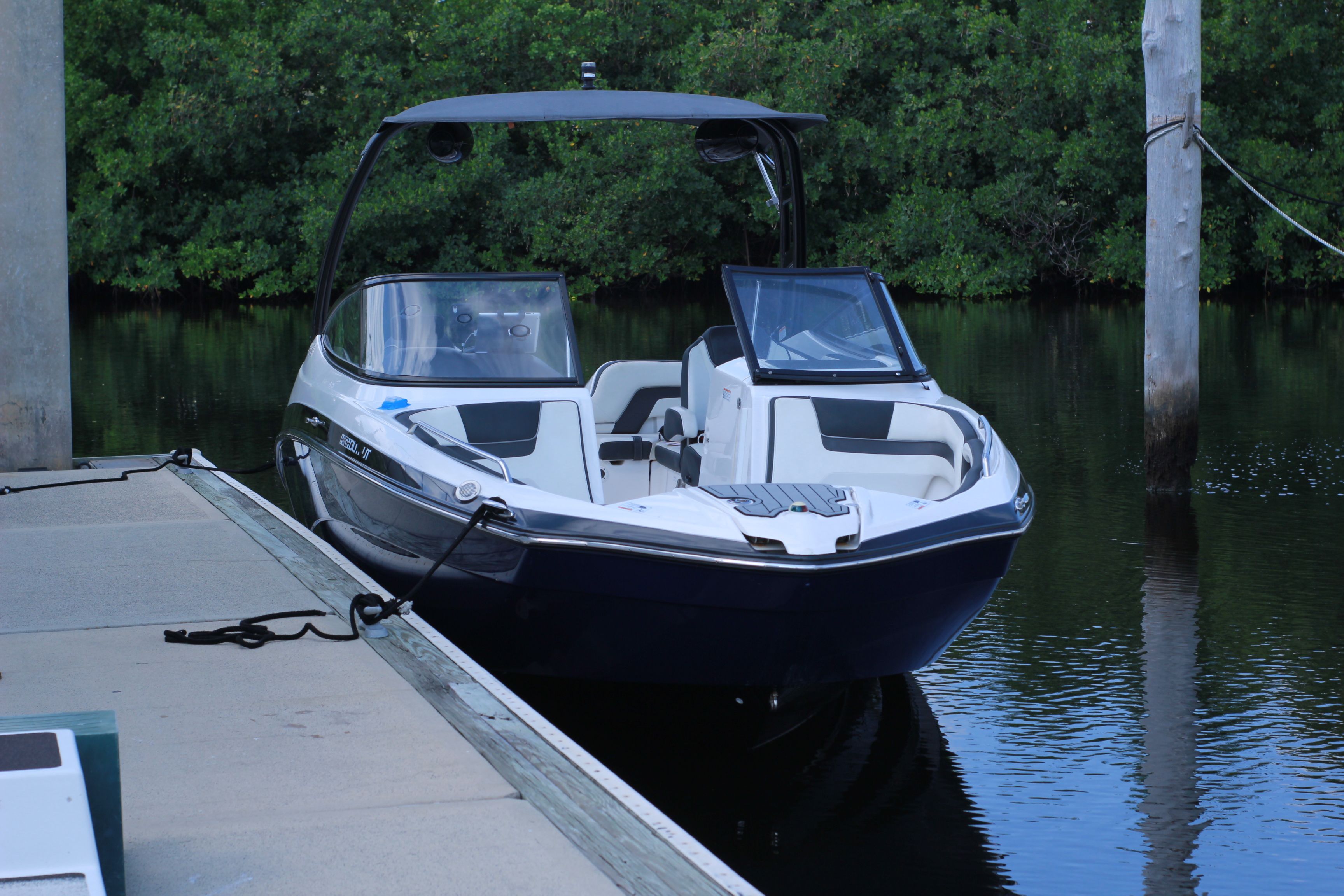2016 Yamaha AR240 boat docked, surrounded by water and trees.