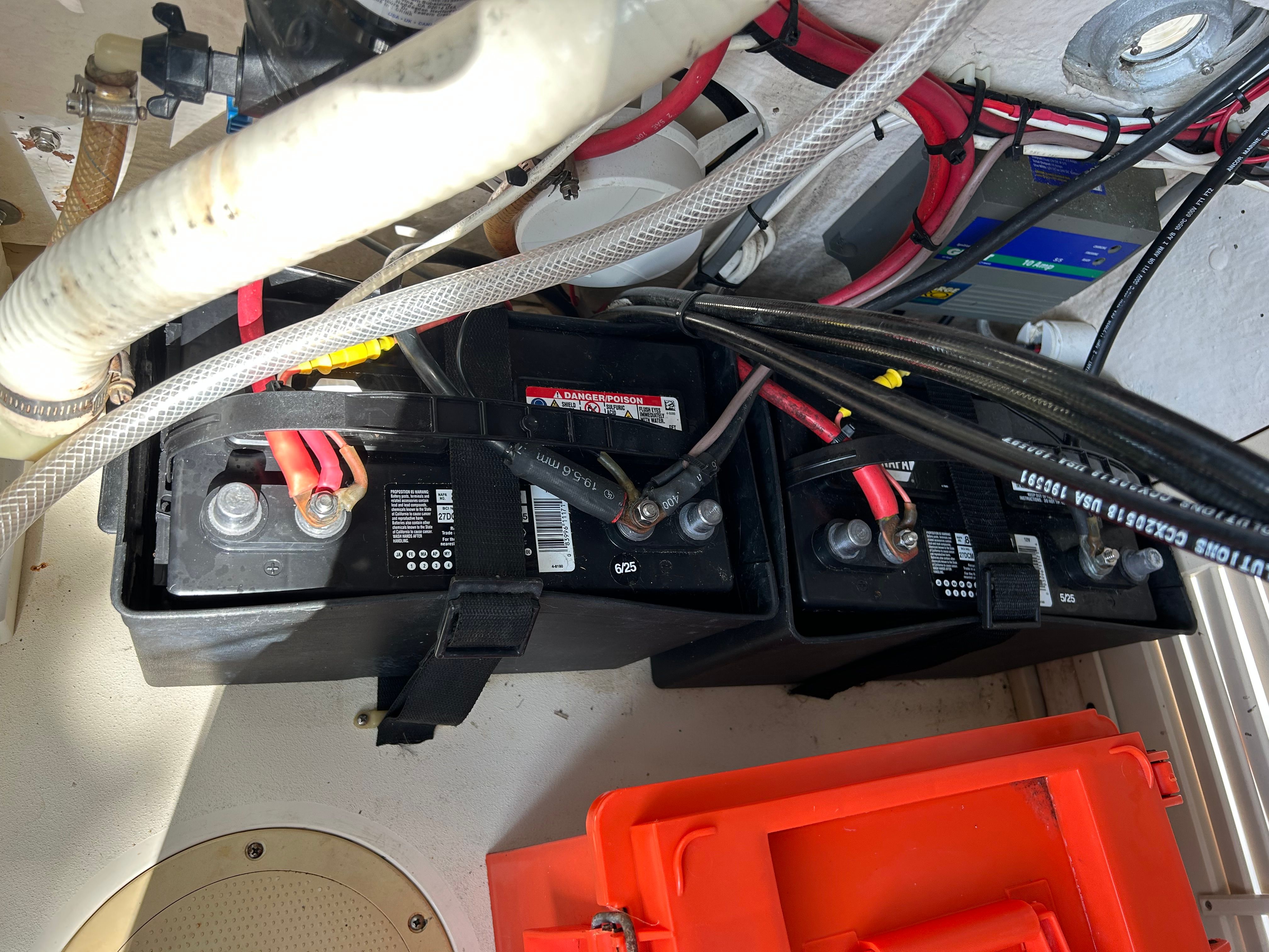 Batteries in Mako 221 boat, 1992 model, with cables and connections.