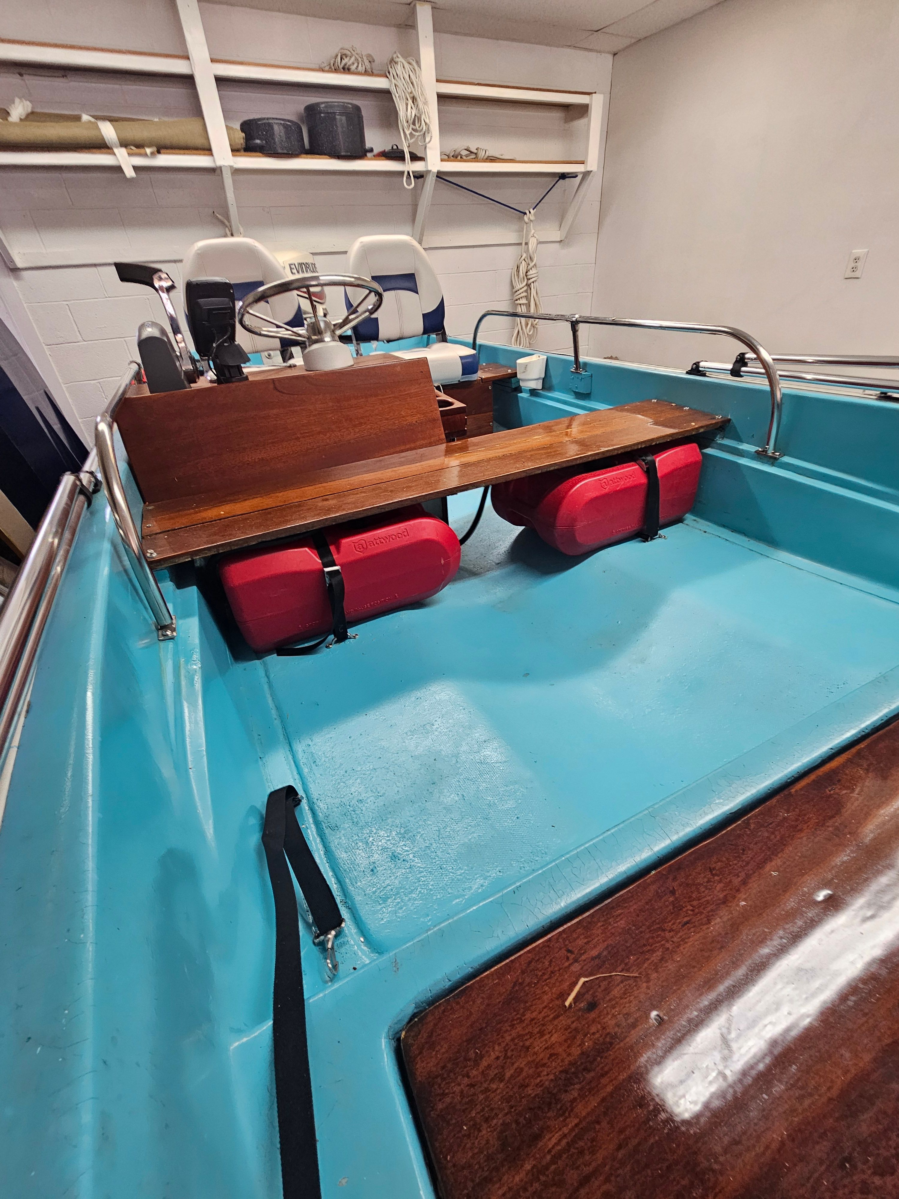 Interior view of a 1977 Boston Whaler 14 boat with blue paint.