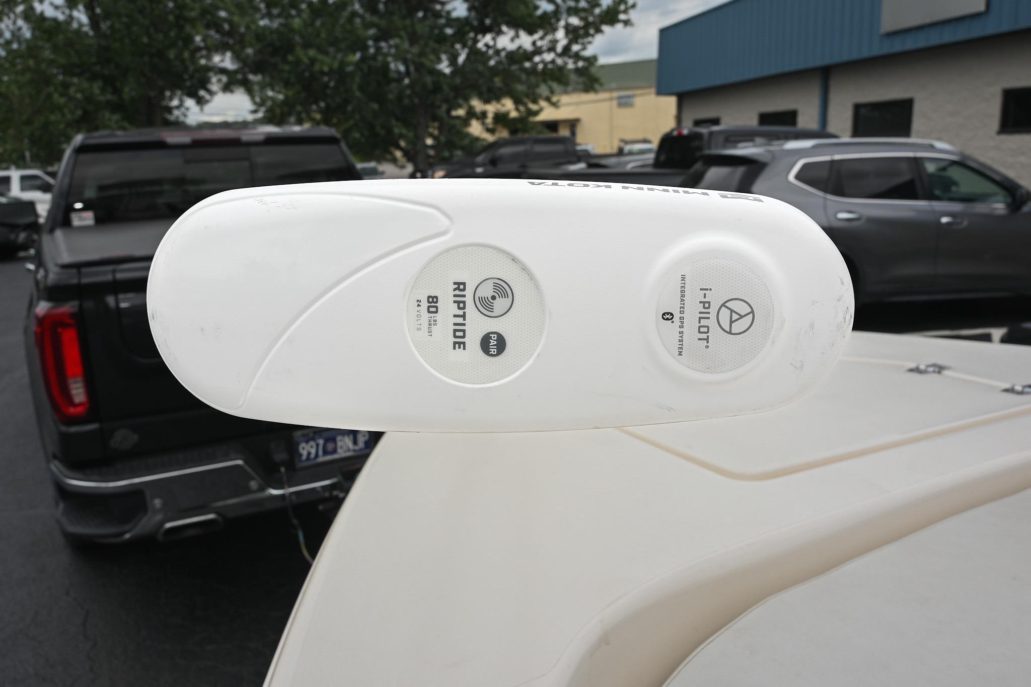 Minn Kota Riptide trolling motor on 2021 Pathfinder 2200 TRS boat, parked in lot.