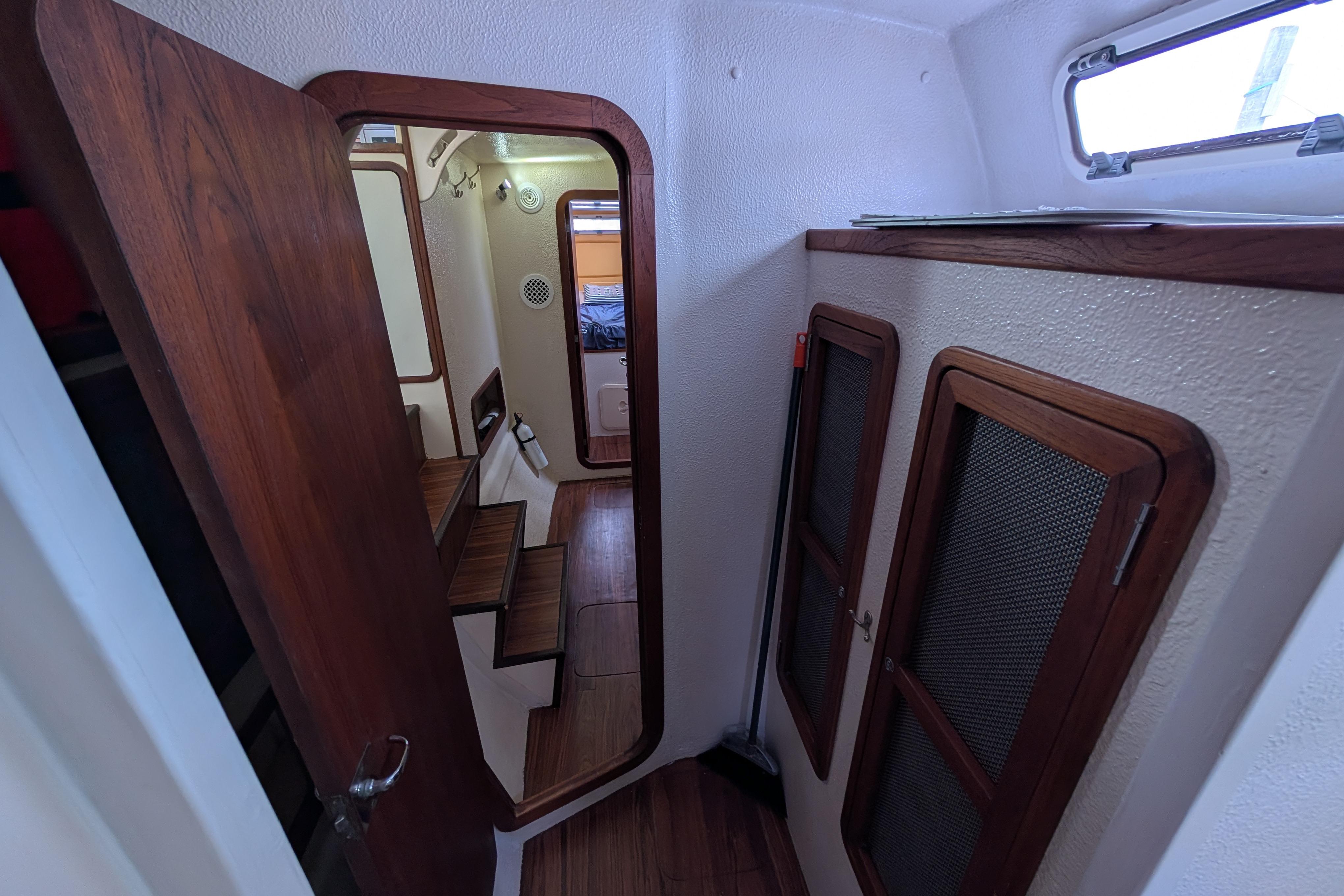 Interior of 1999 Island Spirit 37 sailboat with wooden accents and compact design.