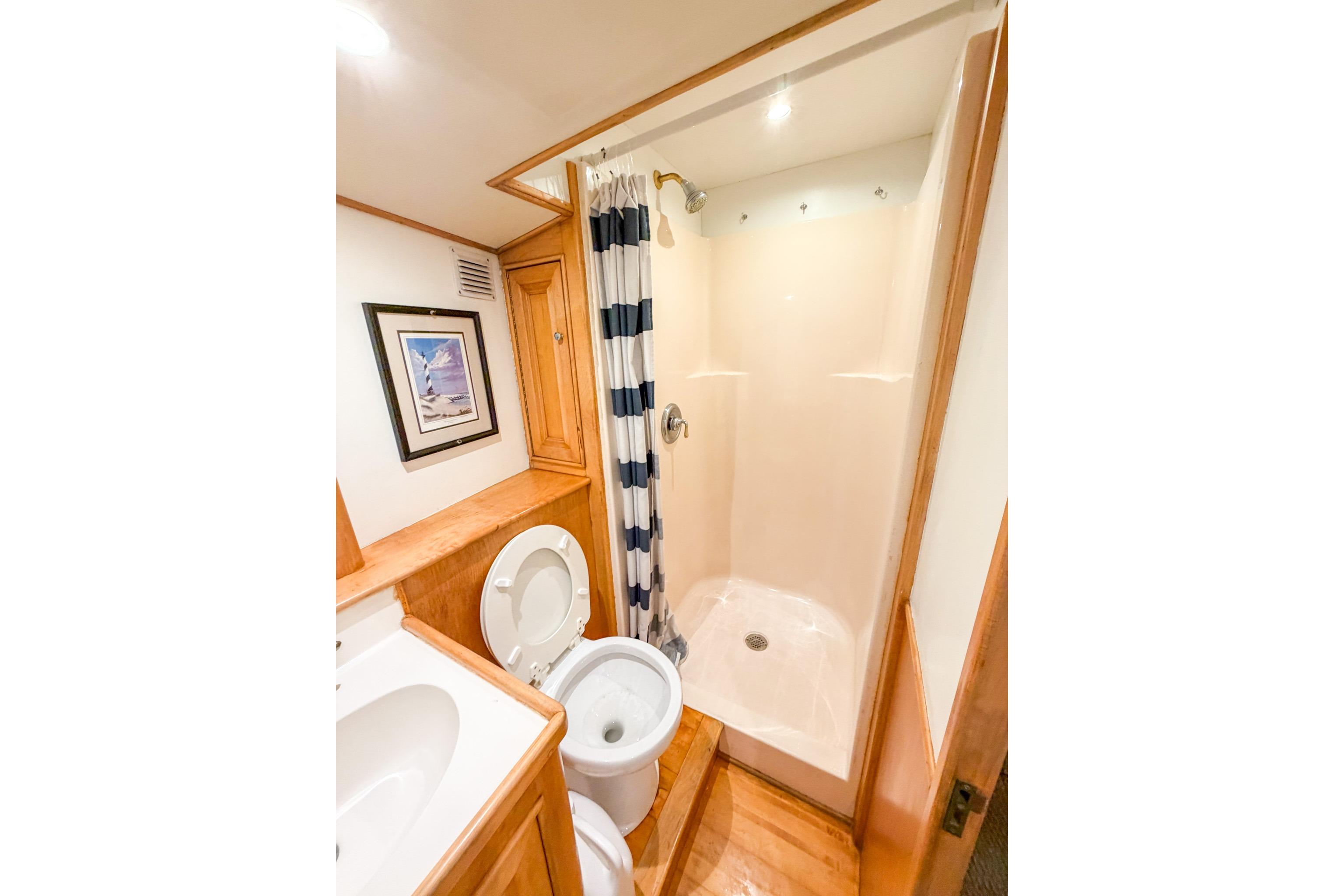 Bathroom interior of 1998 Blackwell Custom Carolina Sportfish with shower and toilet.