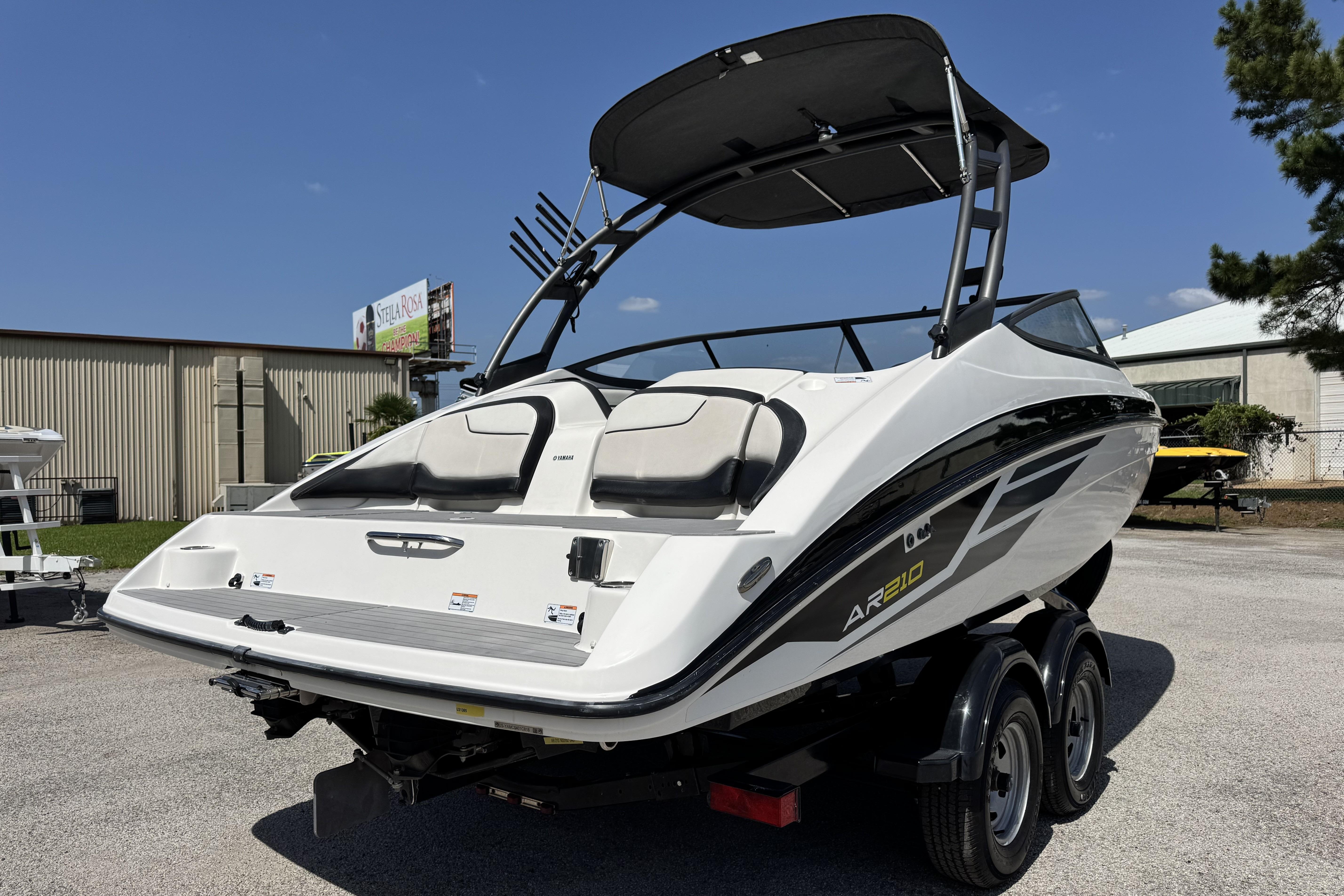 2018 Yamaha Boats AR210 on trailer, sleek design, black and white color, outdoor display.