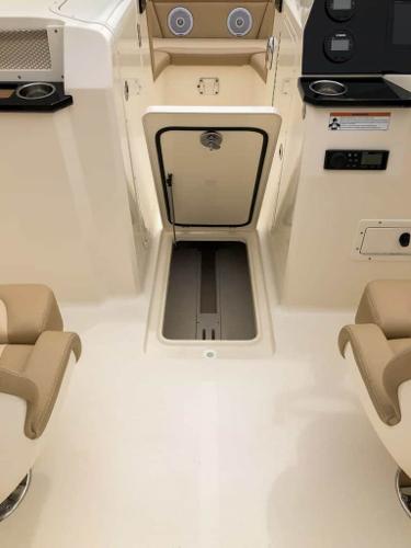2025 Scout 215 Dorado boat interior with seating and storage compartments.
