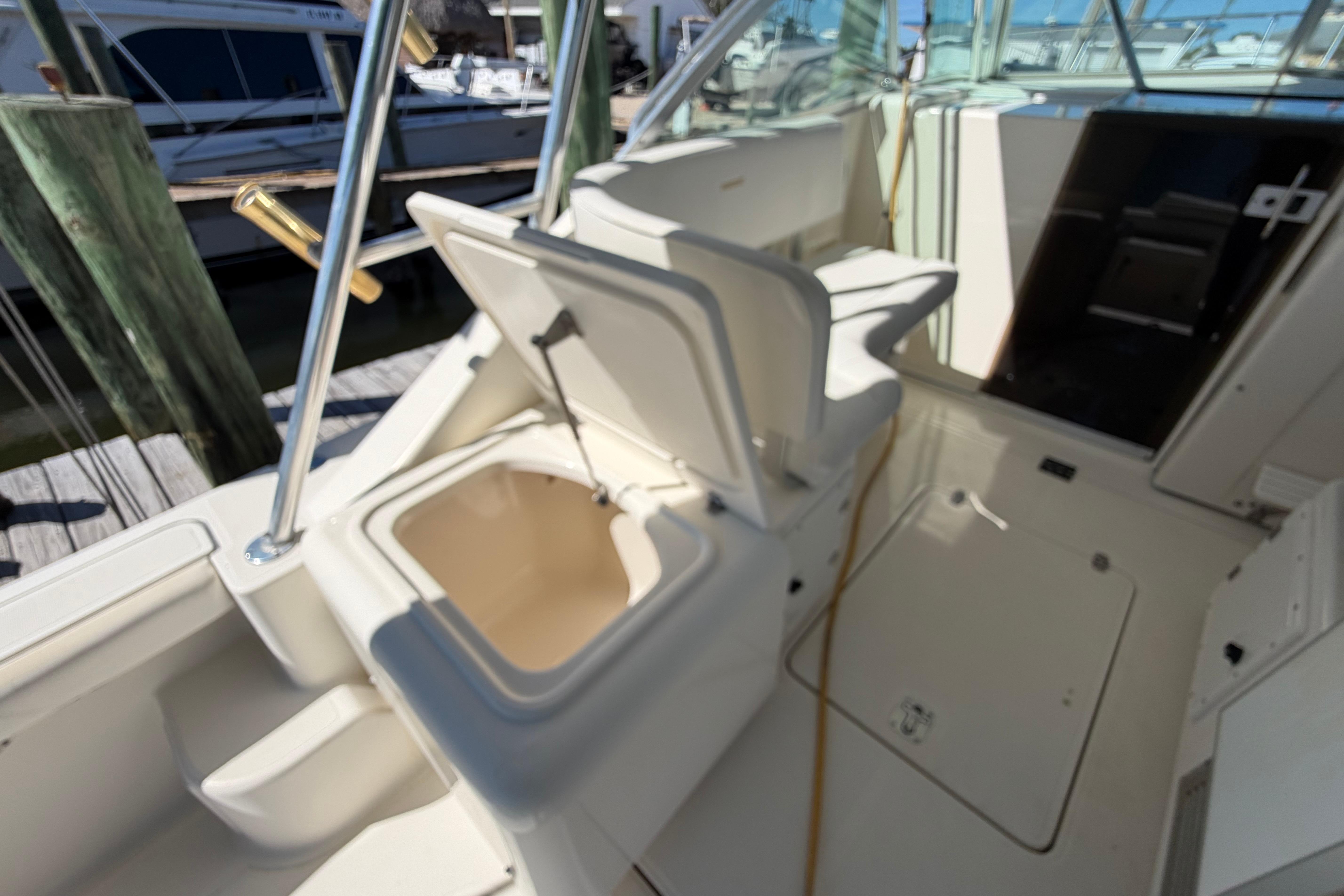 2001 Pursuit 3000 Express boat interior with open storage compartment.