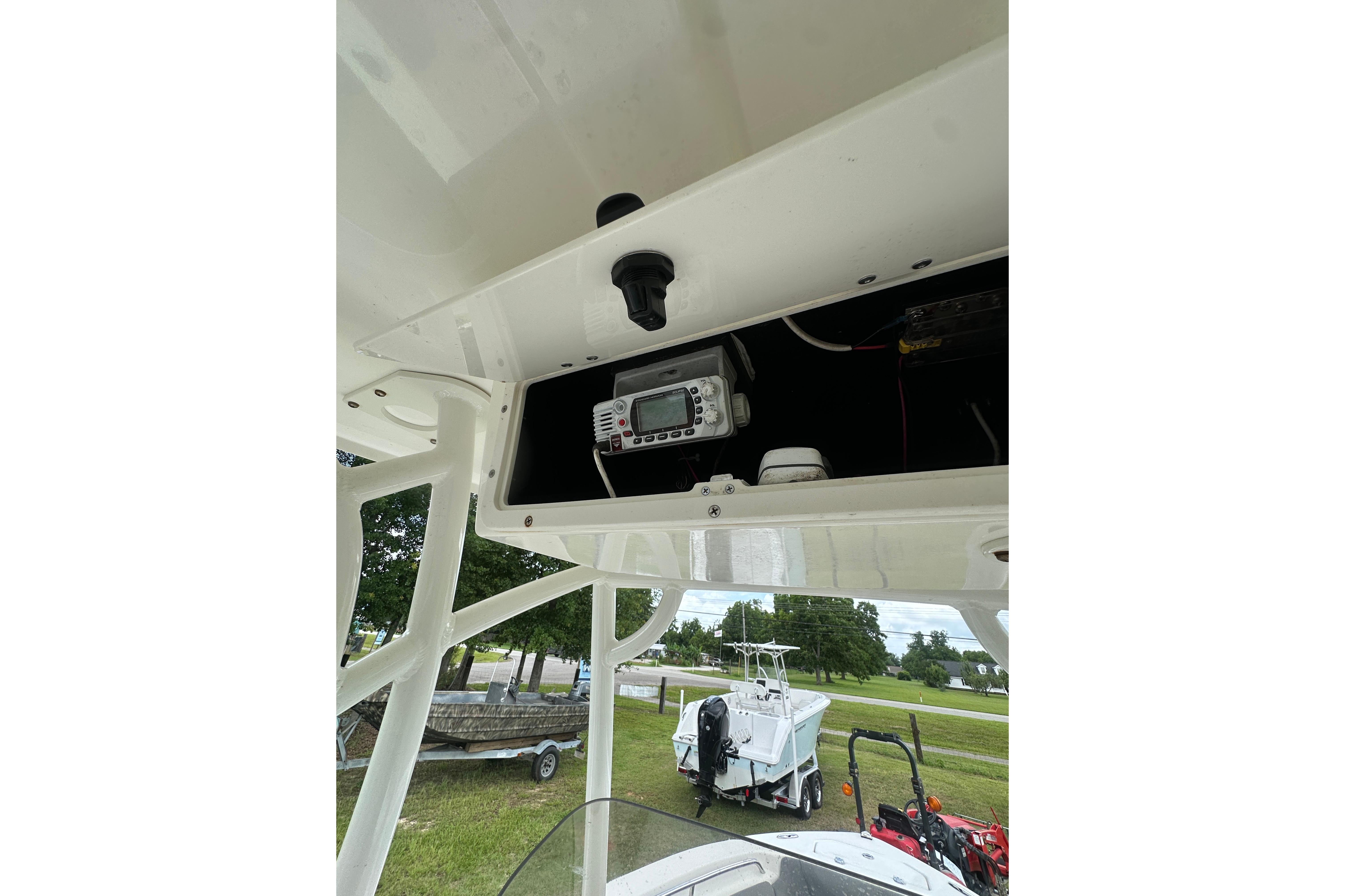 2023 NauticStar 2102 Legacy boat console with electronic equipment storage.
