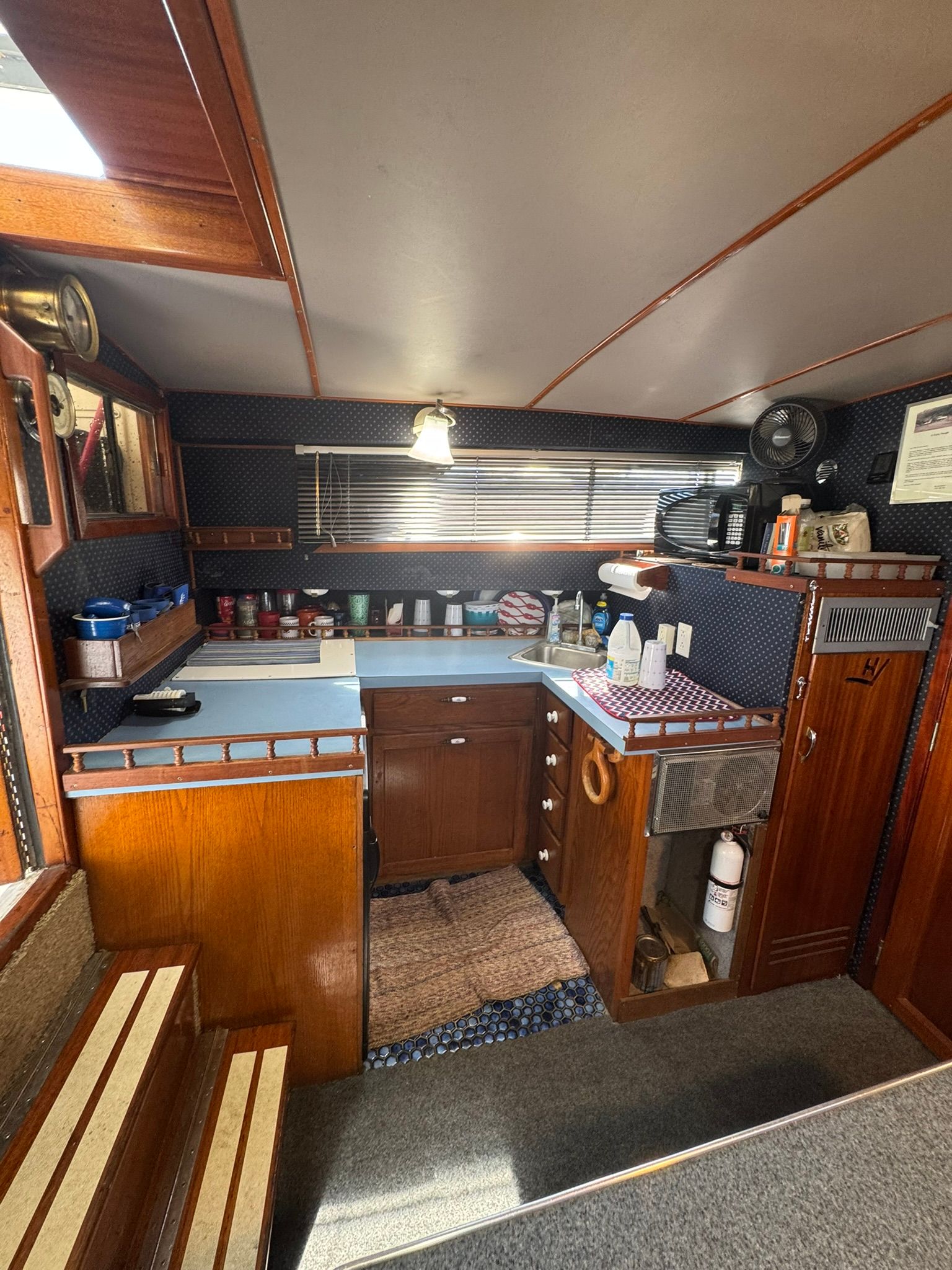 Interior of 1968 Hatteras 31 Flybridge featuring kitchen area.