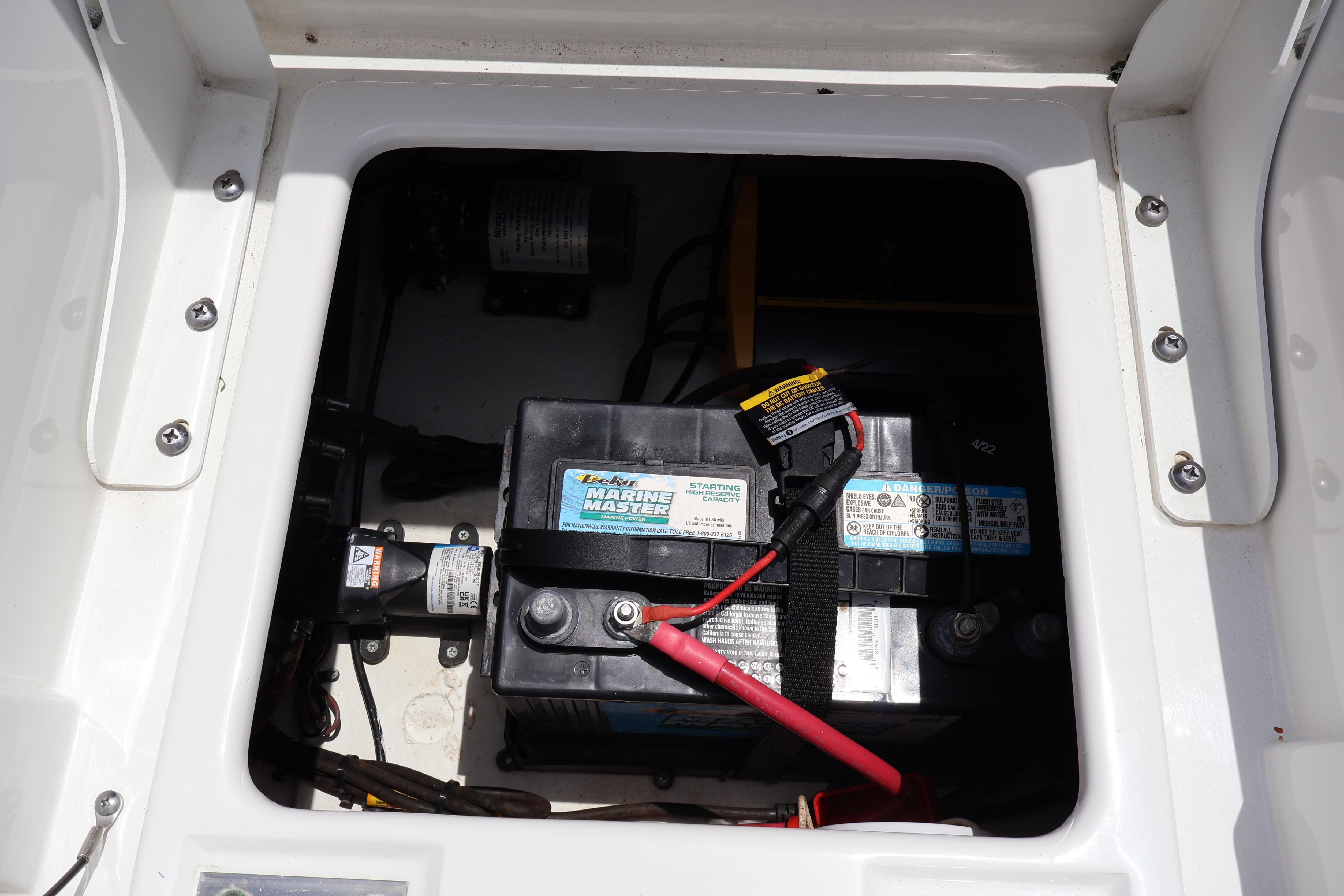 Battery compartment of 2022 Sea Hunt BX 25 FS boat, featuring Marine Master battery.