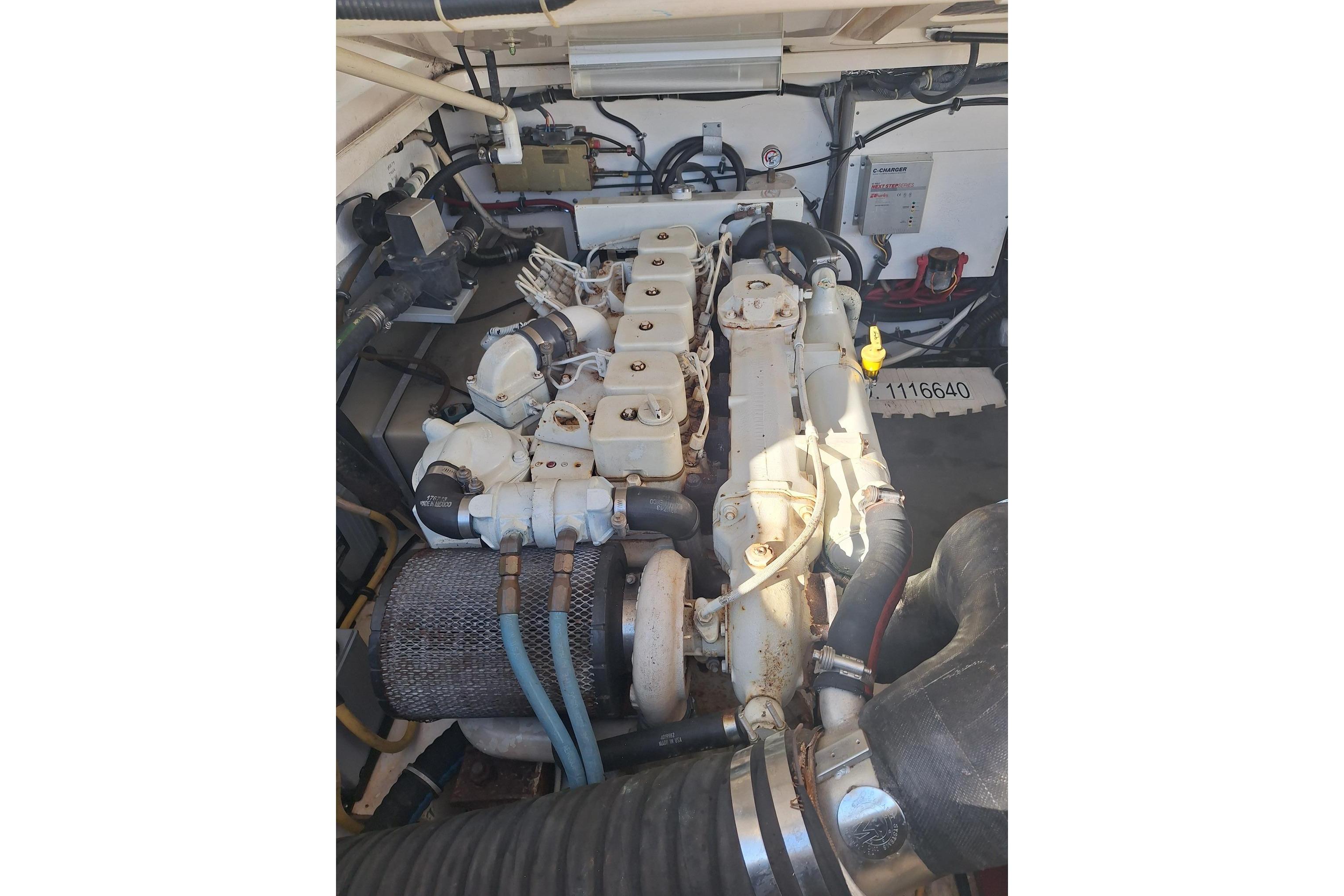 Engine compartment of a 2002 Tiara Yachts 3500 Open, showcasing mechanical components.