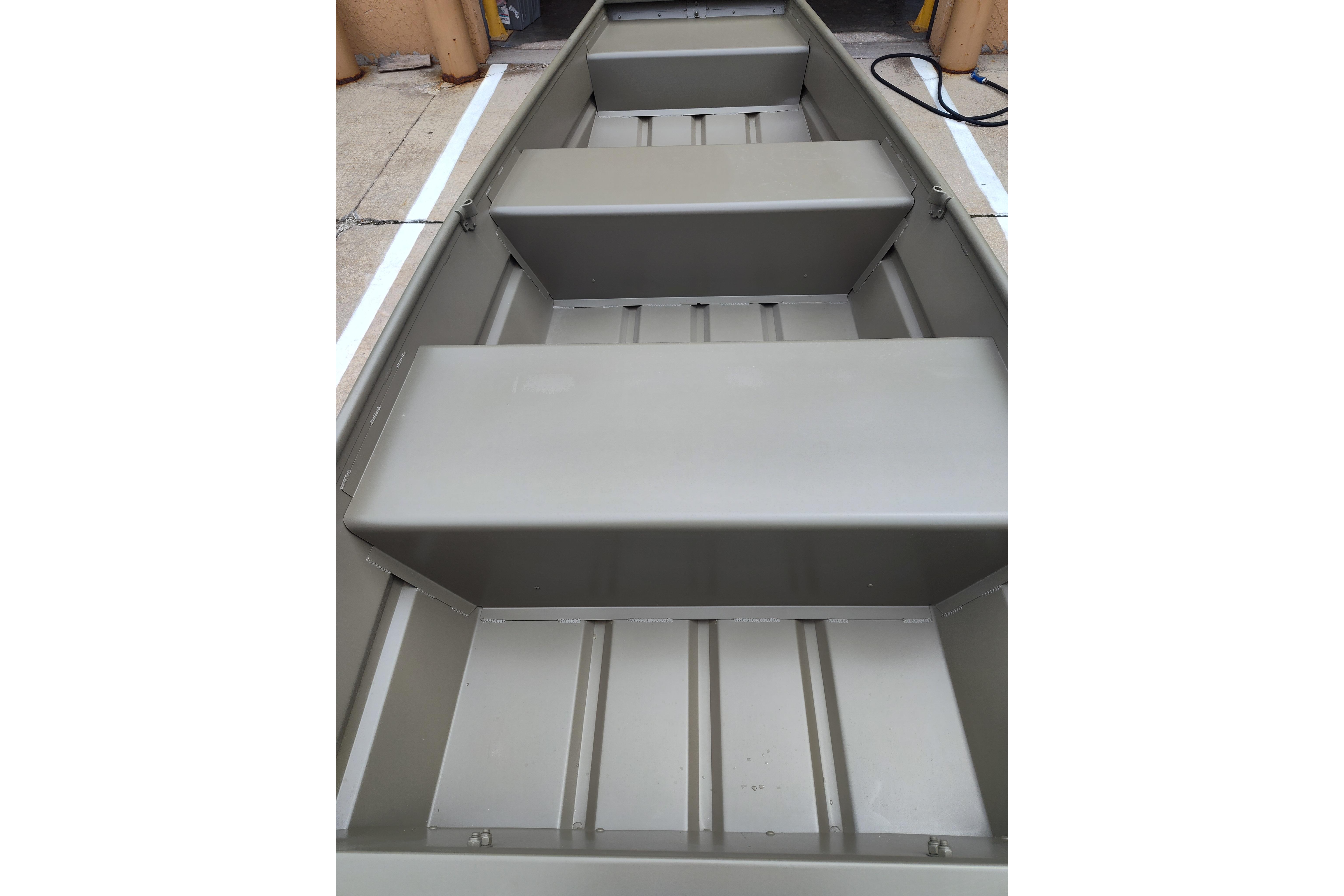 2025 Tracker Grizzly 1036 Utility boat interior with bench seats and durable construction.