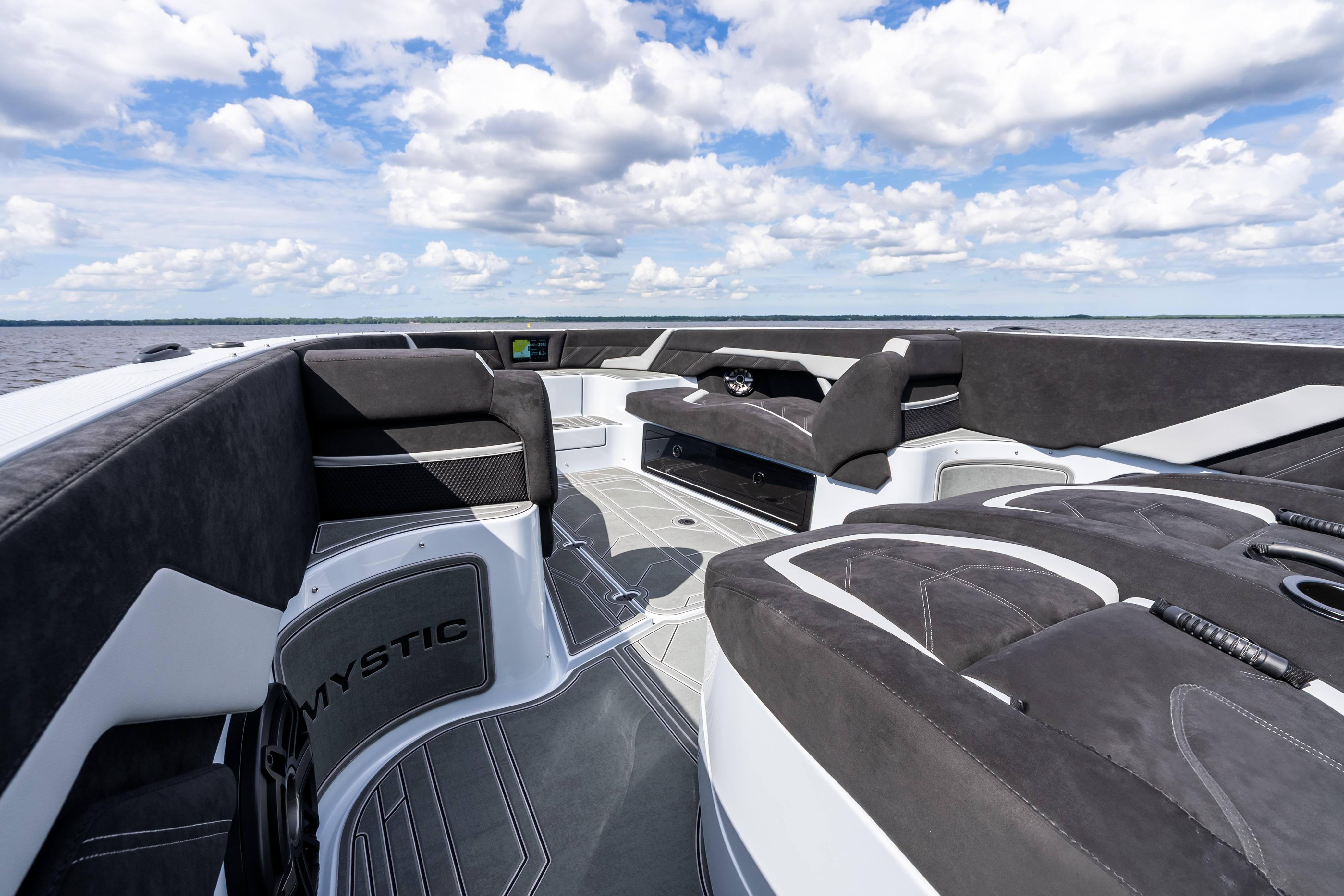 2027 Mystic Powerboats M4200 interior with sleek seating and modern design on open water.