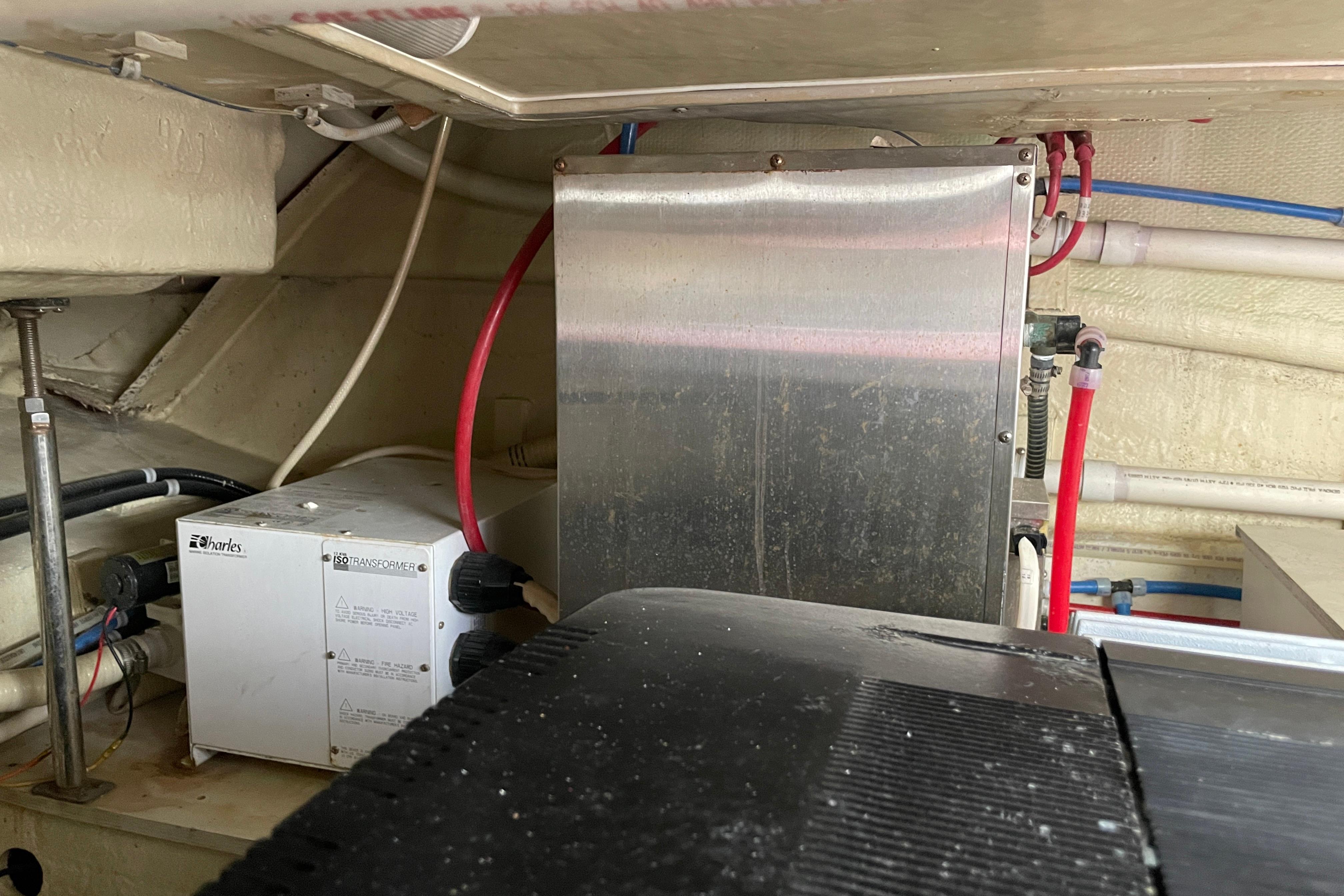 Engine room of a 2008 Marquis 40 SC yacht with electrical components and piping.