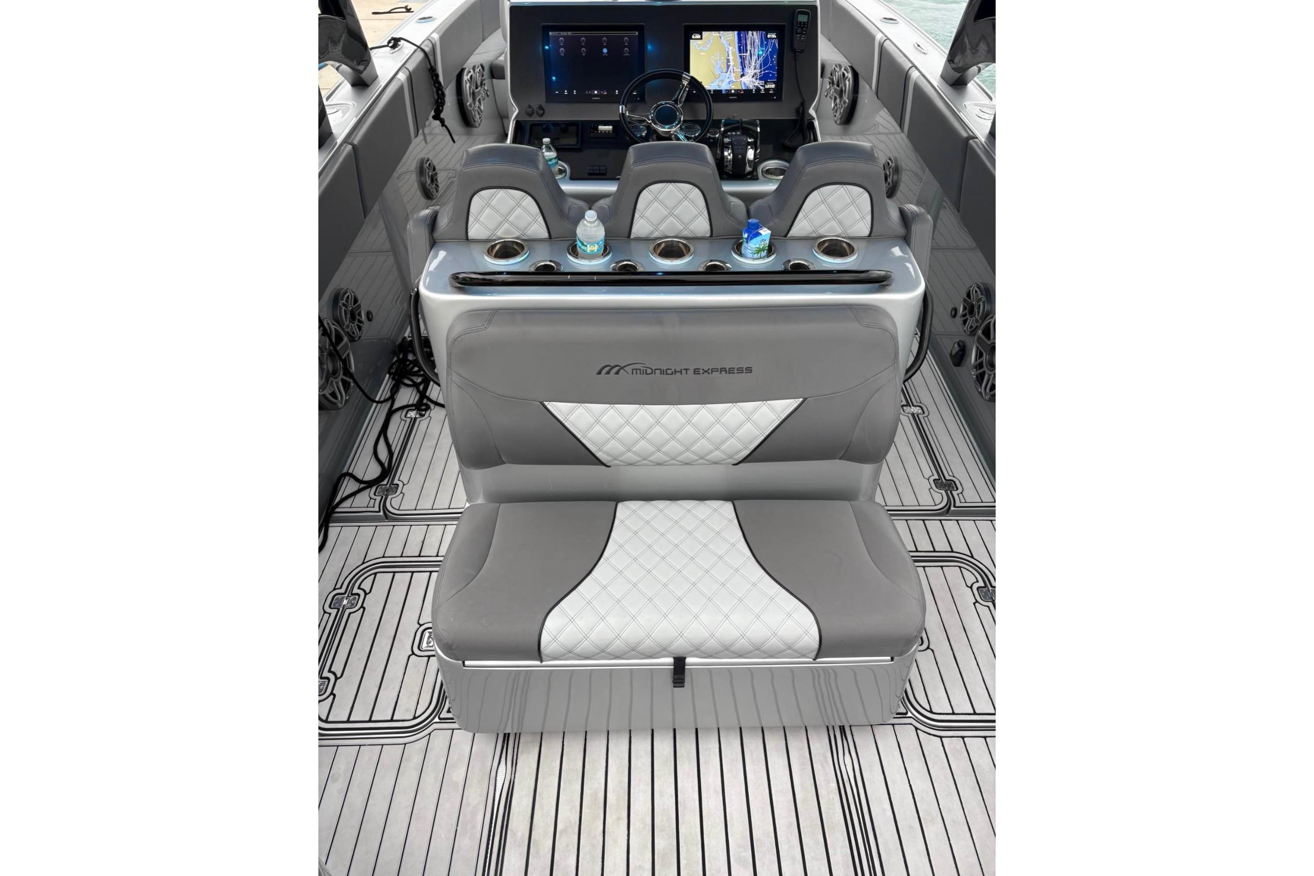 2021 Midnight Express 37 Open boat interior with luxury seating and modern dashboard.