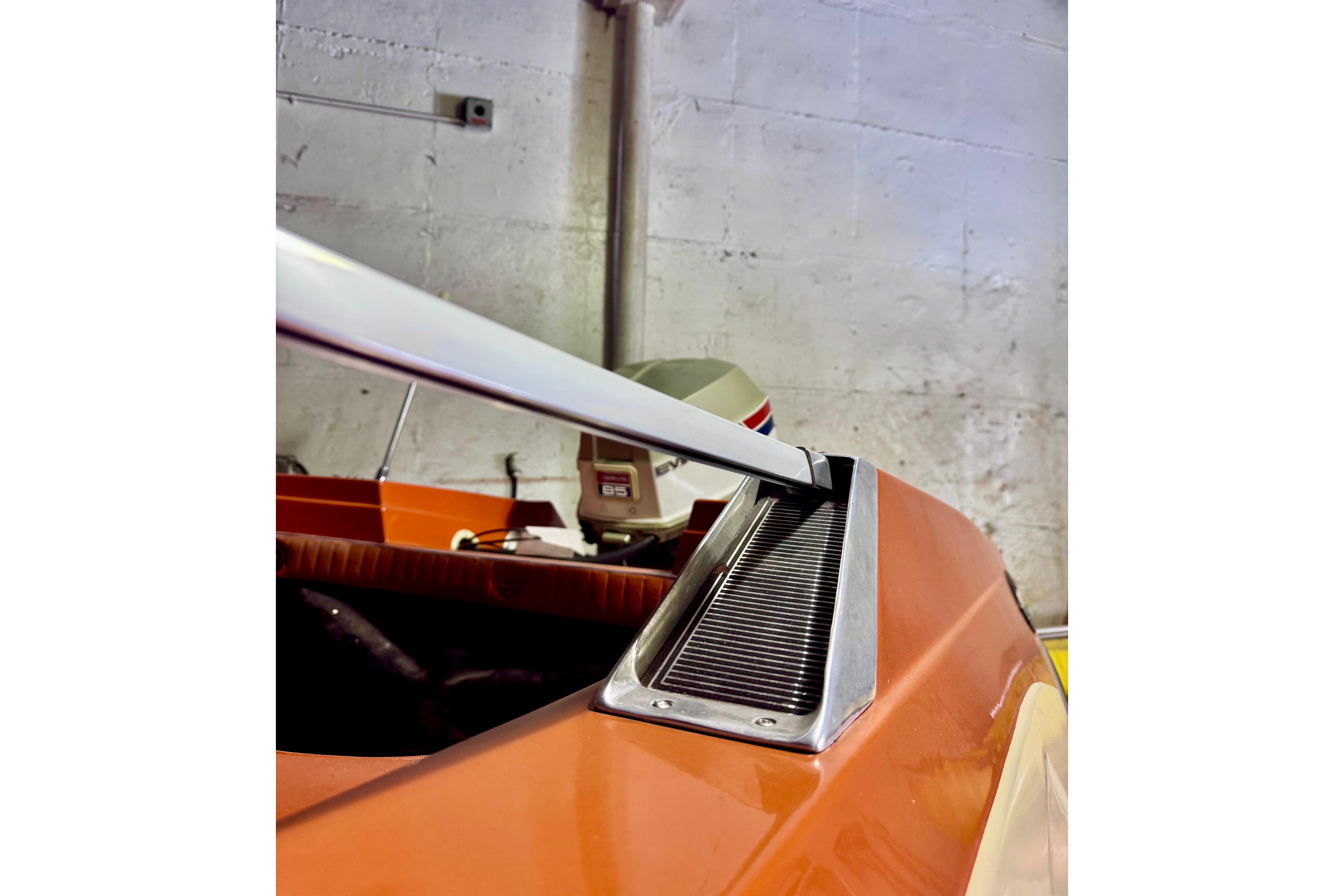 1971 Glastron/Carlson GT 15 boat detail with orange exterior and sleek design.