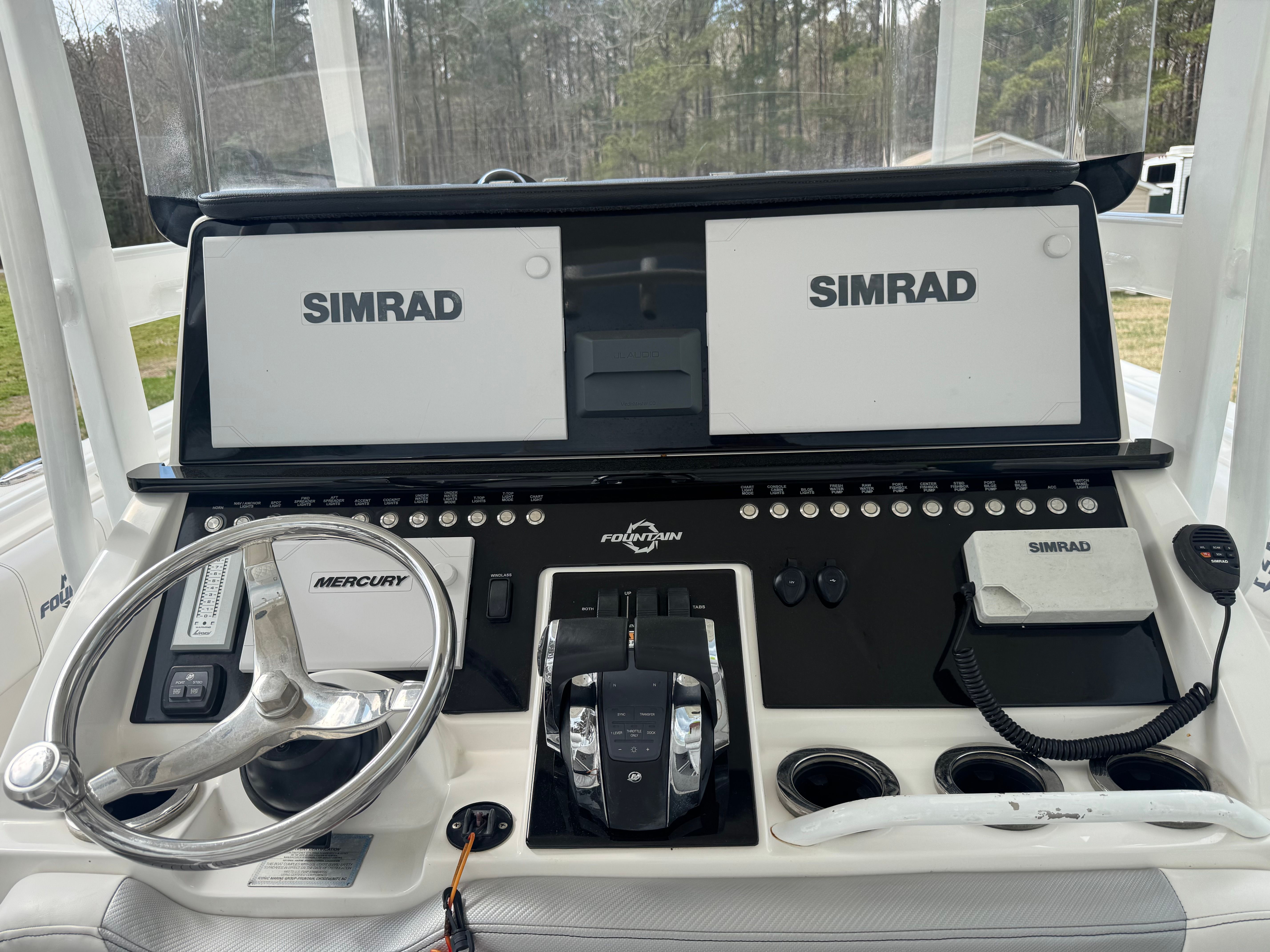 Fountain 34 Center Console 2019 with Simrad displays and Mercury controls.