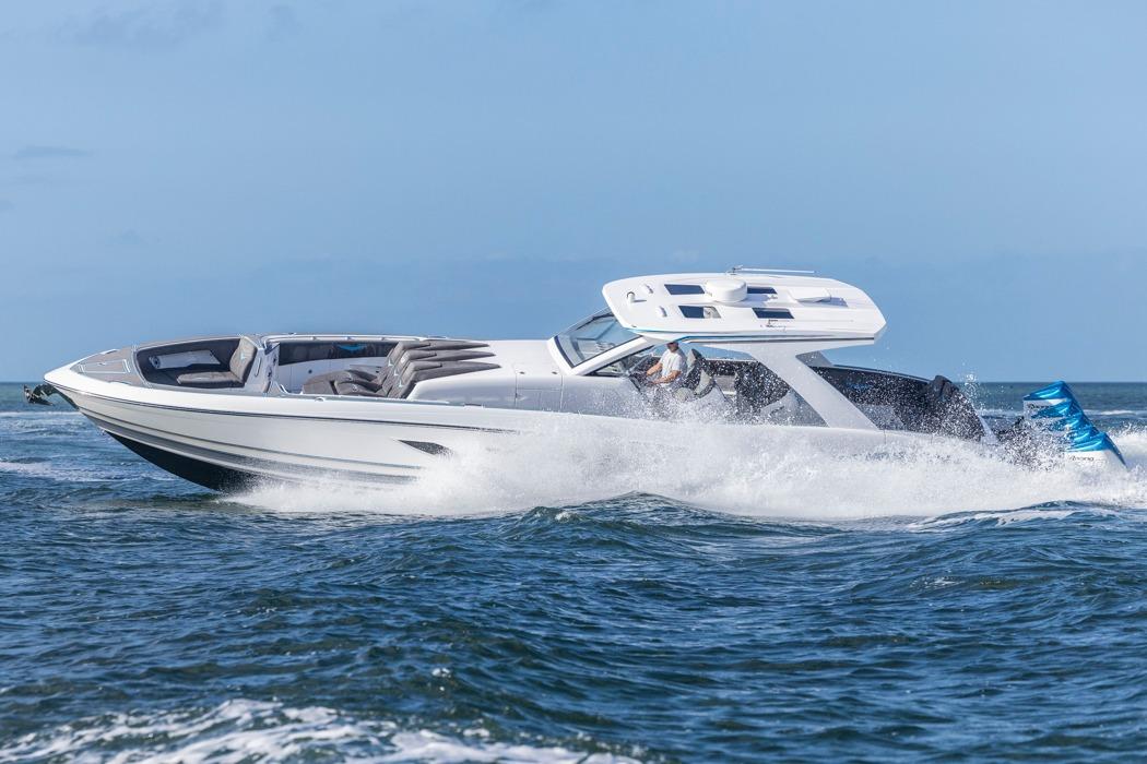 2025 Deep Impact 499 Sport boat cruising on open water, showcasing sleek design and performance.