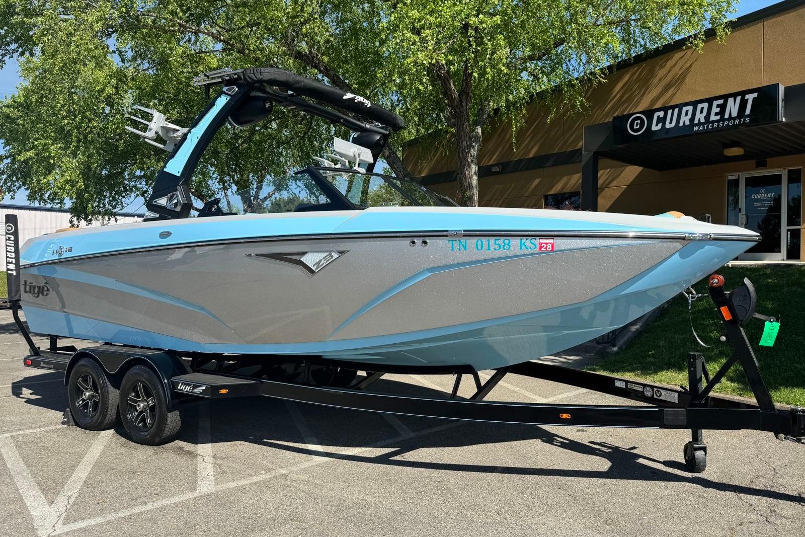 2022 Tigé Z3 boat on trailer outside Current Watersports dealership.