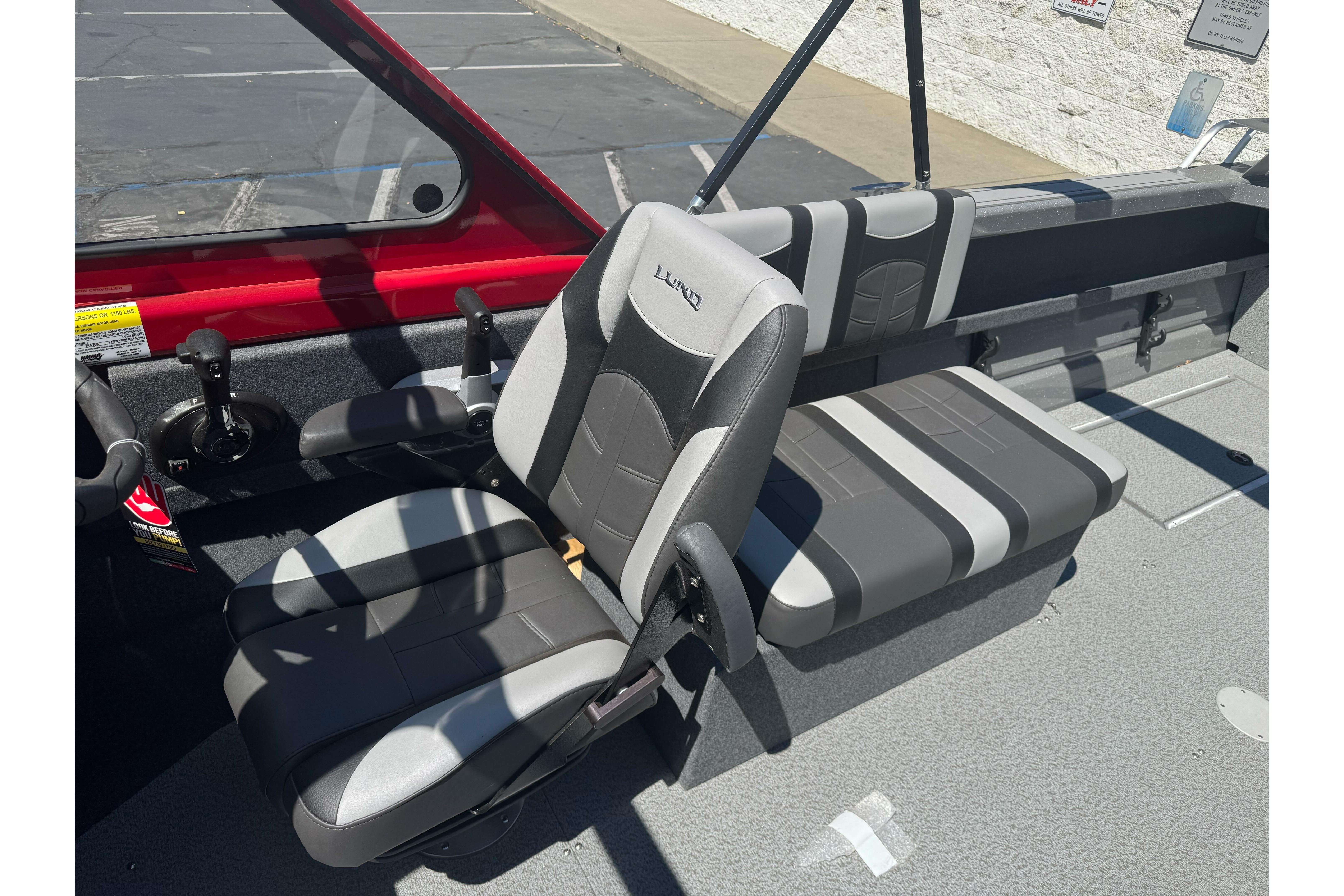 2026 Lund 210 Heavy Gauge boat interior with gray and black seating.