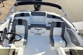 2026 Tahoe T21 boat interior with modern seating and steering wheel.