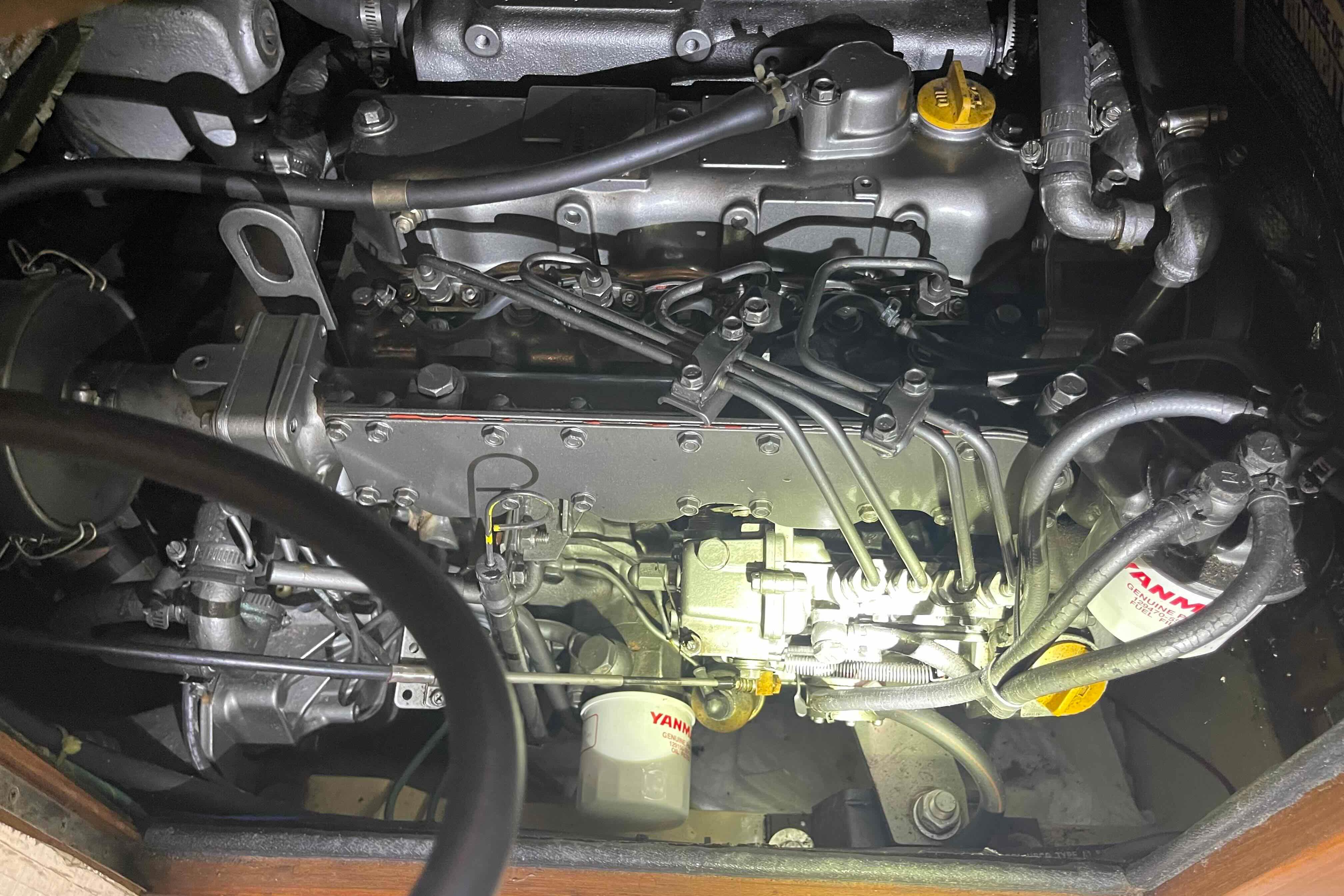 Engine compartment of a 1998 Island Packet 40 sailboat, featuring Yanmar components.