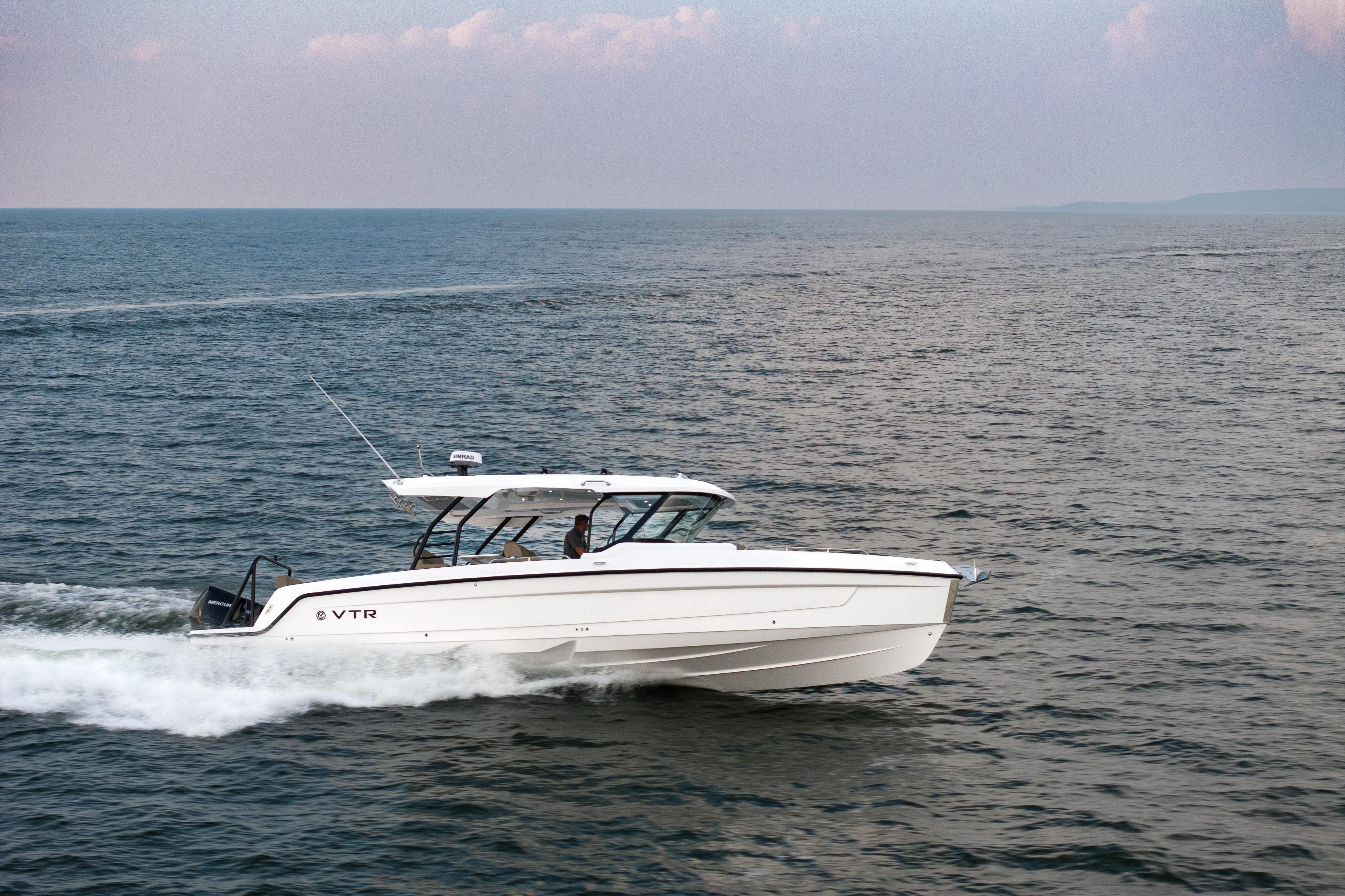2026 Cruisers Yachts 38 VTR speeding on open water, showcasing sleek design and performance.
