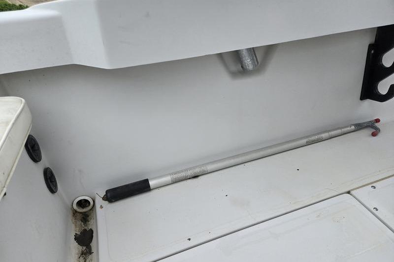 Interior of a 1996 Boston Whaler Outrage 17 boat, featuring a clean white deck.