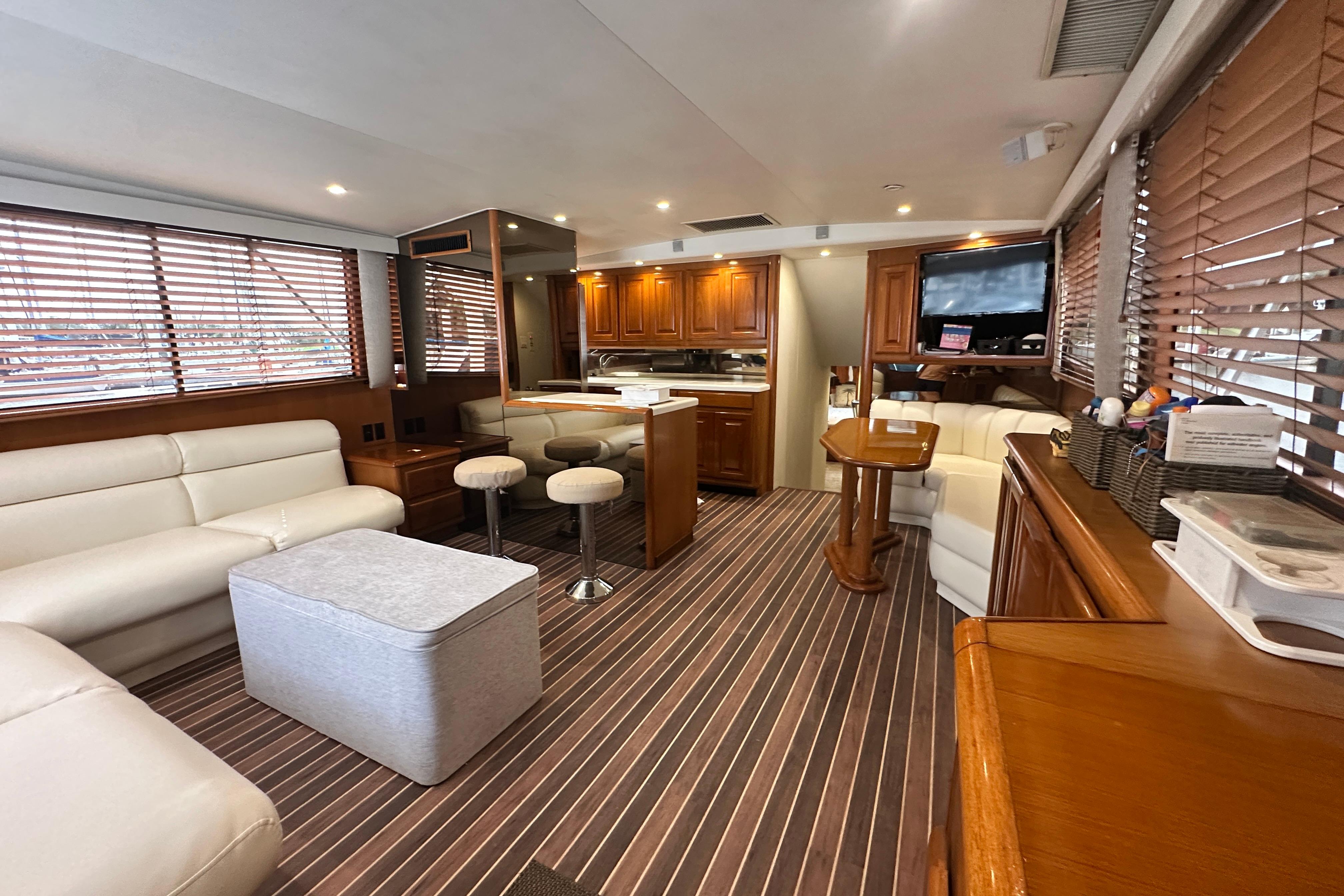 Luxurious interior of a 1997 Viking 58 Convertible yacht with elegant wood finishes.