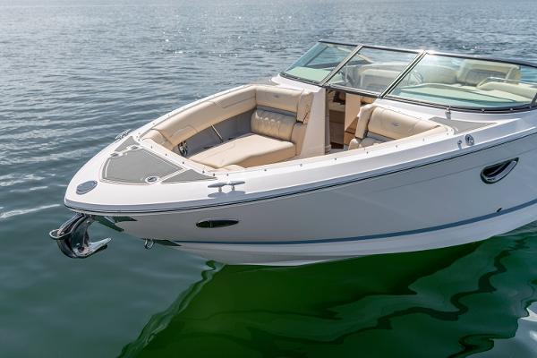 Manufacturer Provided Image: 2026 Regal LS6 boat on calm water, featuring sleek design and spacious seating.