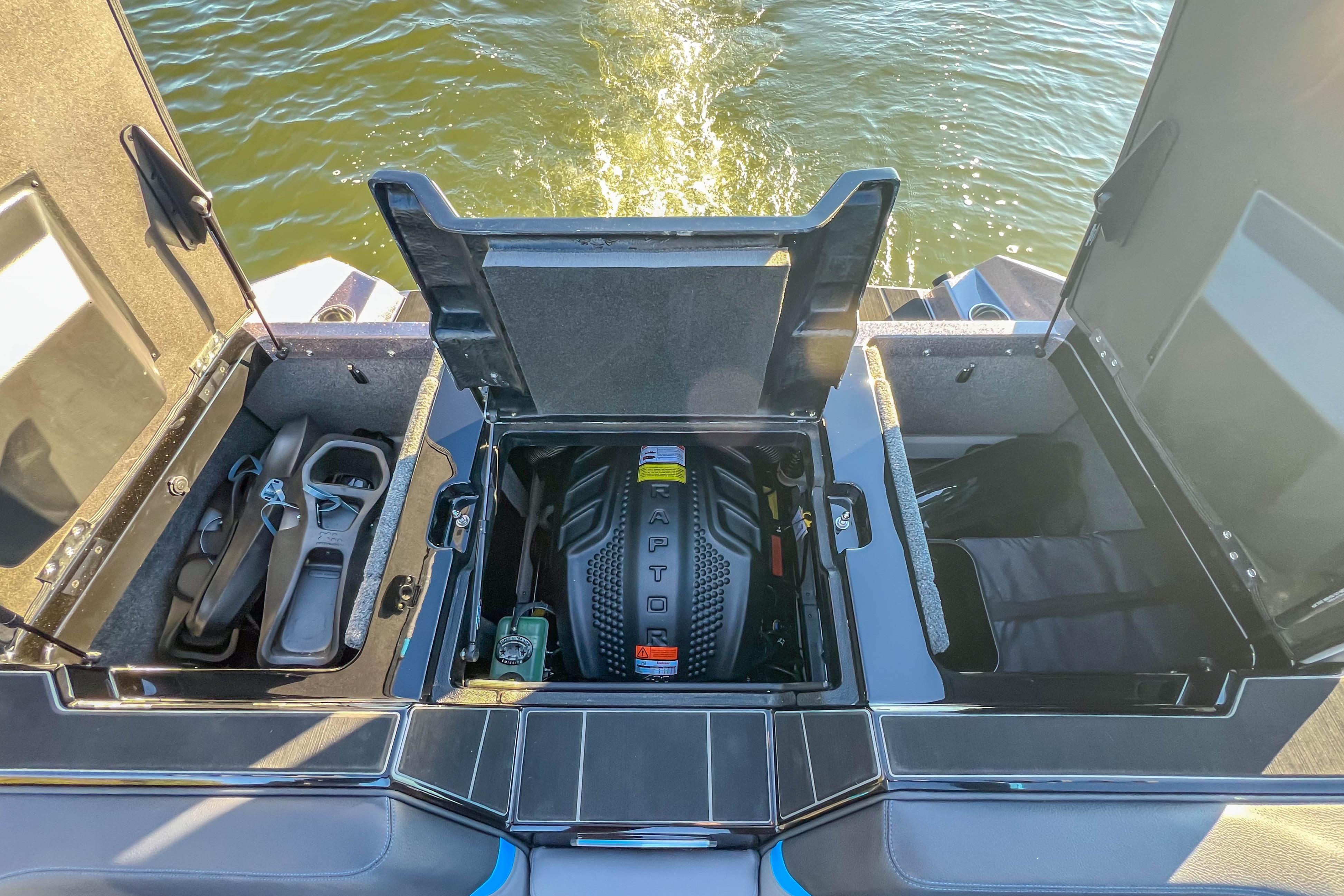 2024 Supra SV 400 boat engine compartment with storage and Raptor engine visible.