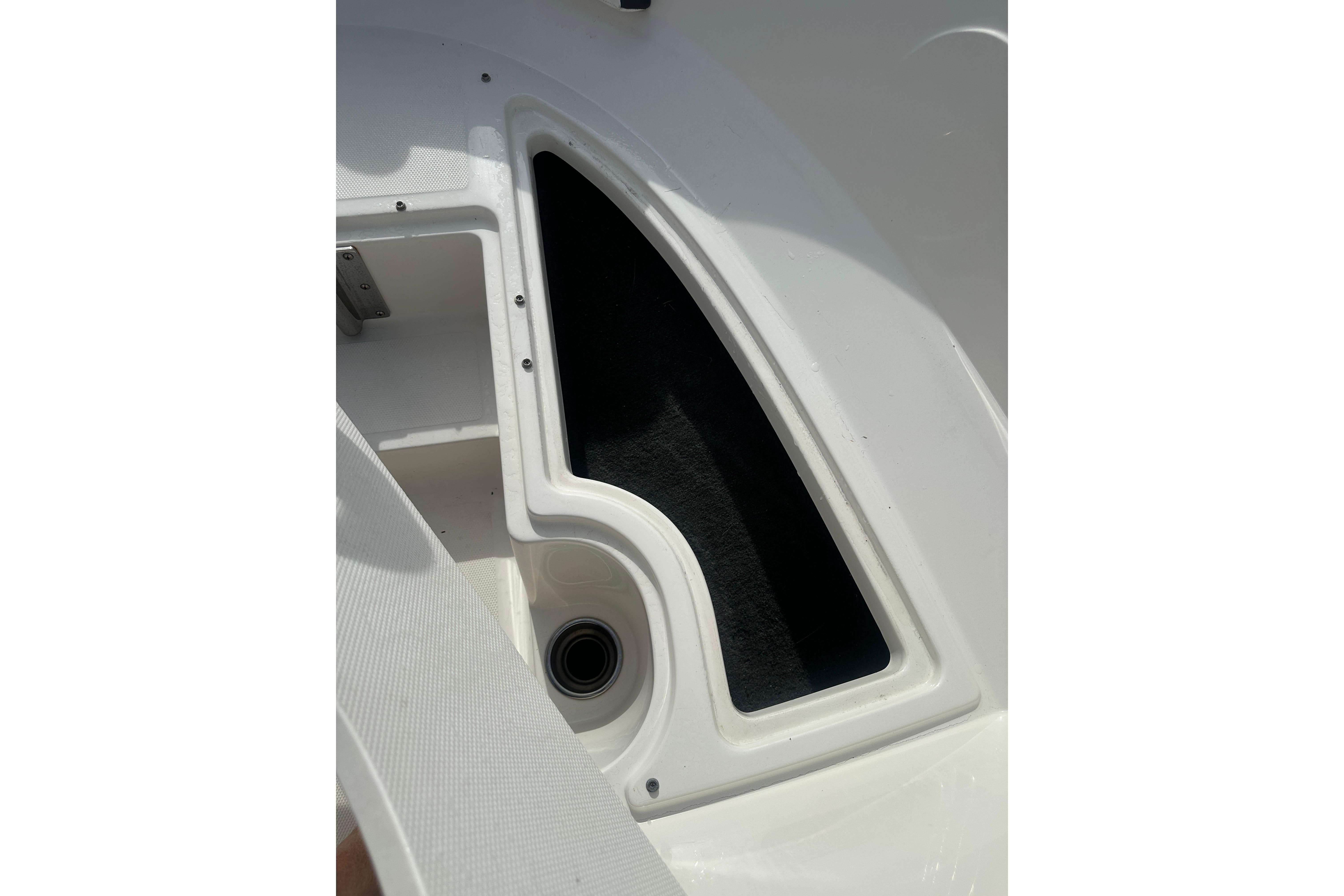 Storage compartment on a 2017 Sea Ray SPX 190 Outboard boat, featuring sleek white design.