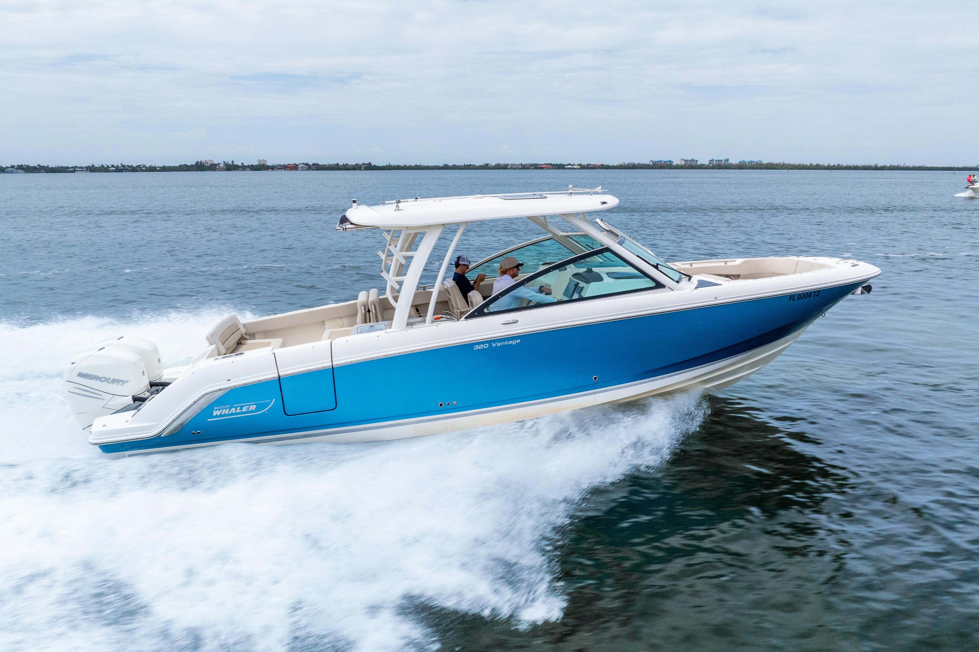 2017 Boston Whaler 320 Vantage cruising on open water, showcasing sleek design and performance.