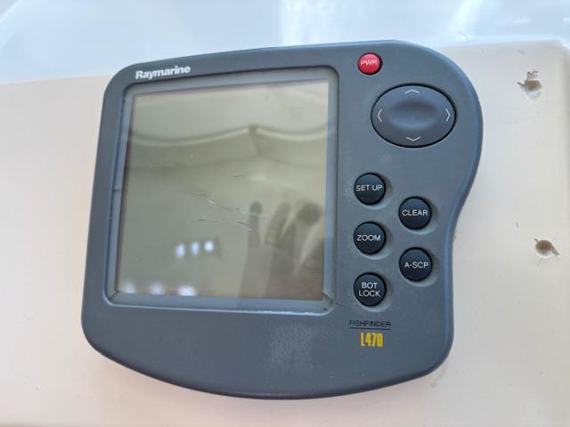 Raymarine L470 fishfinder on 1988 Riviera Convertible boat dashboard.