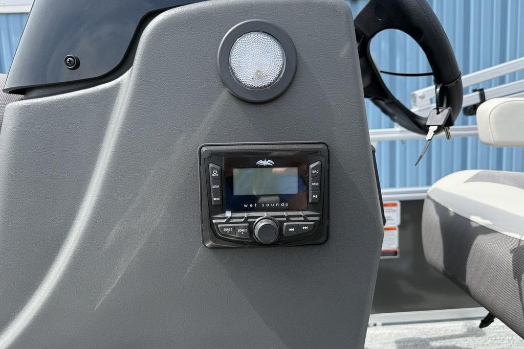 Control panel of 2026 Sun Tracker Bass Buggy 16 XL Select boat with audio system.