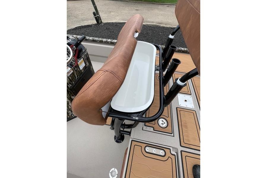 2026 Avid 21 FSX boat seat with rod holders and storage compartment.