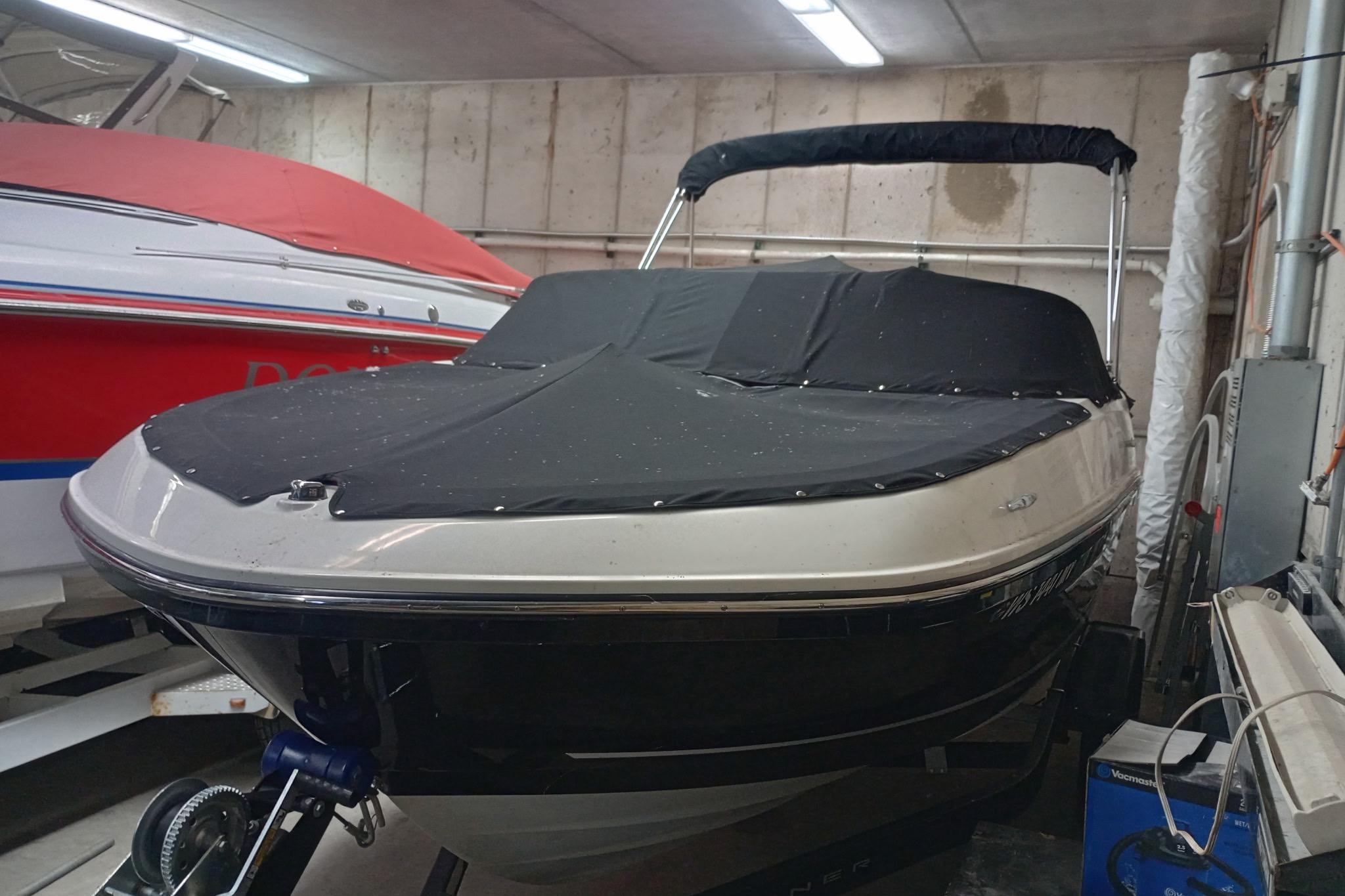 2022 Bayliner VR5 Bowrider I/O boat with cover in indoor storage.