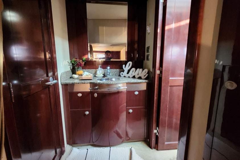 Luxurious 2007 Sea Ray 480 Sundancer interior with elegant wood cabinetry and decorative accents.