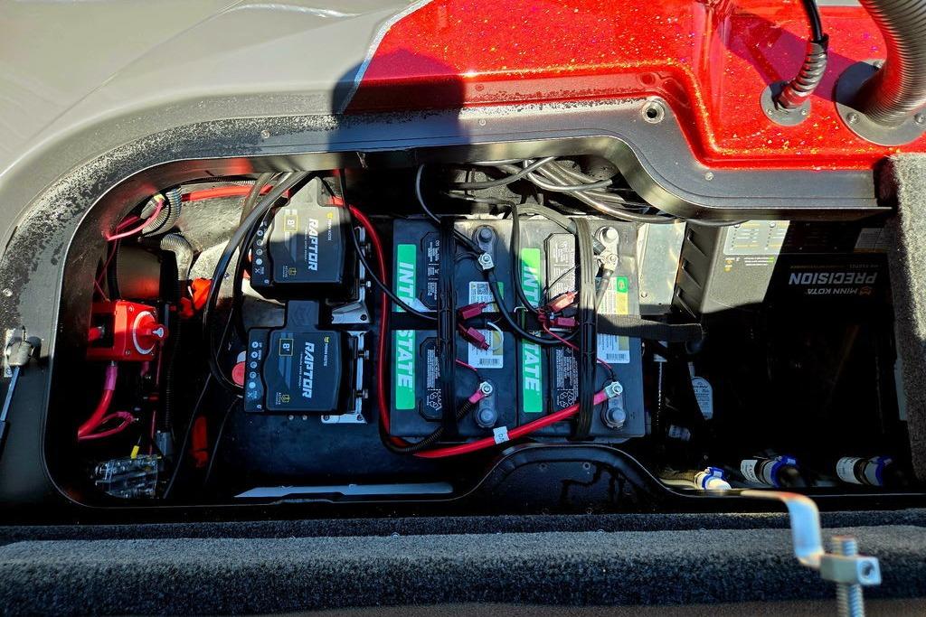 Battery compartment of a 2026 Skeeter ZXE20 boat, featuring multiple batteries and wiring.
