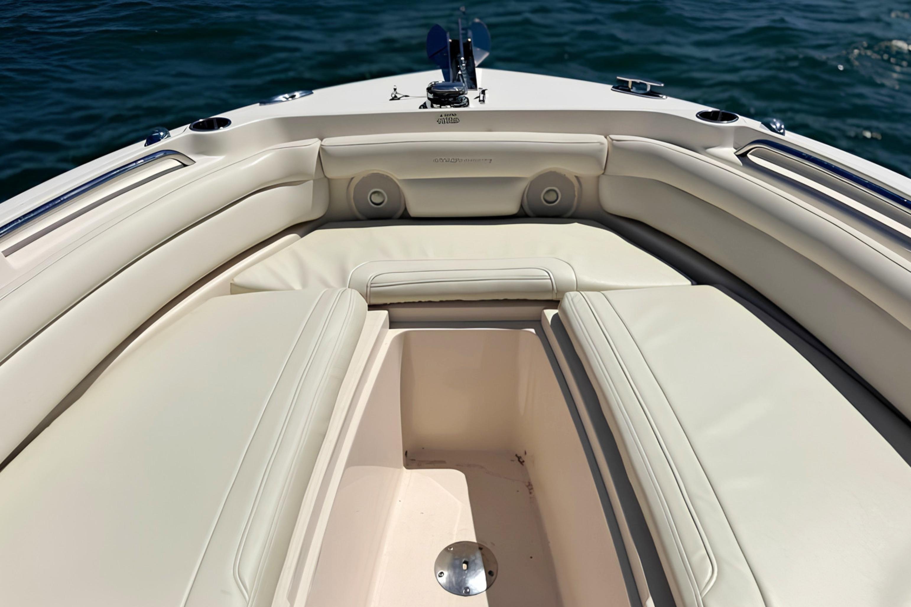 2017 Grady-White Freedom 235 boat interior with cushioned seating and storage.