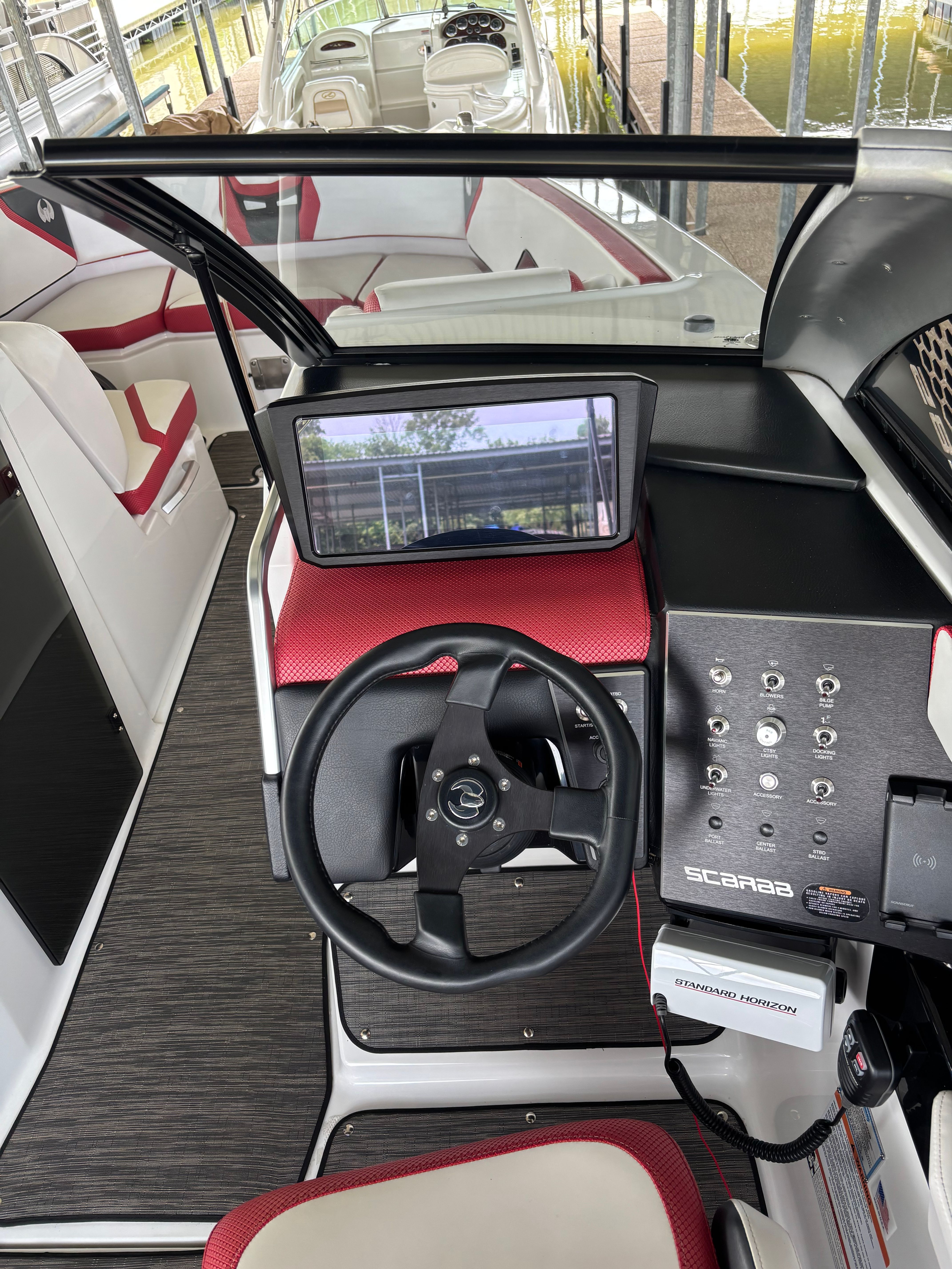 Interior of a 2021 Scarab 285 ID boat with red and black design.