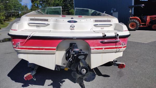 1999 Chaparral 2130 SS boat, rear view, parked outdoors.