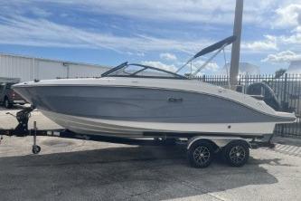2017 Sea Ray SPX 210 Outboard boat on trailer, parked outdoors.