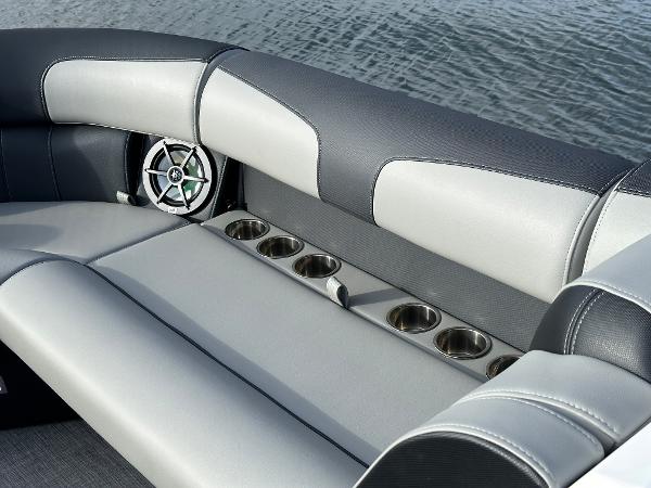 Interior seating of 2025 Montara Surf Boss 2.0 25 with cup holders and speaker.