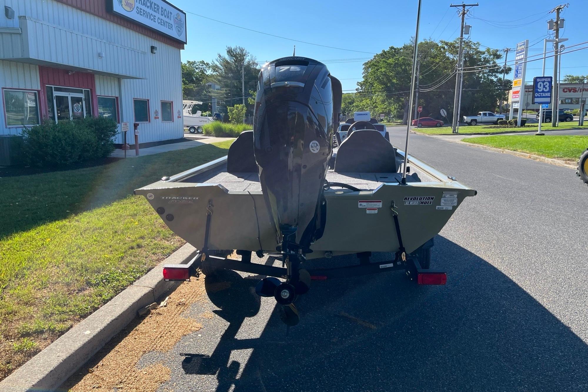 2026 Tracker Pro Team 175 boat on trailer outside service center.