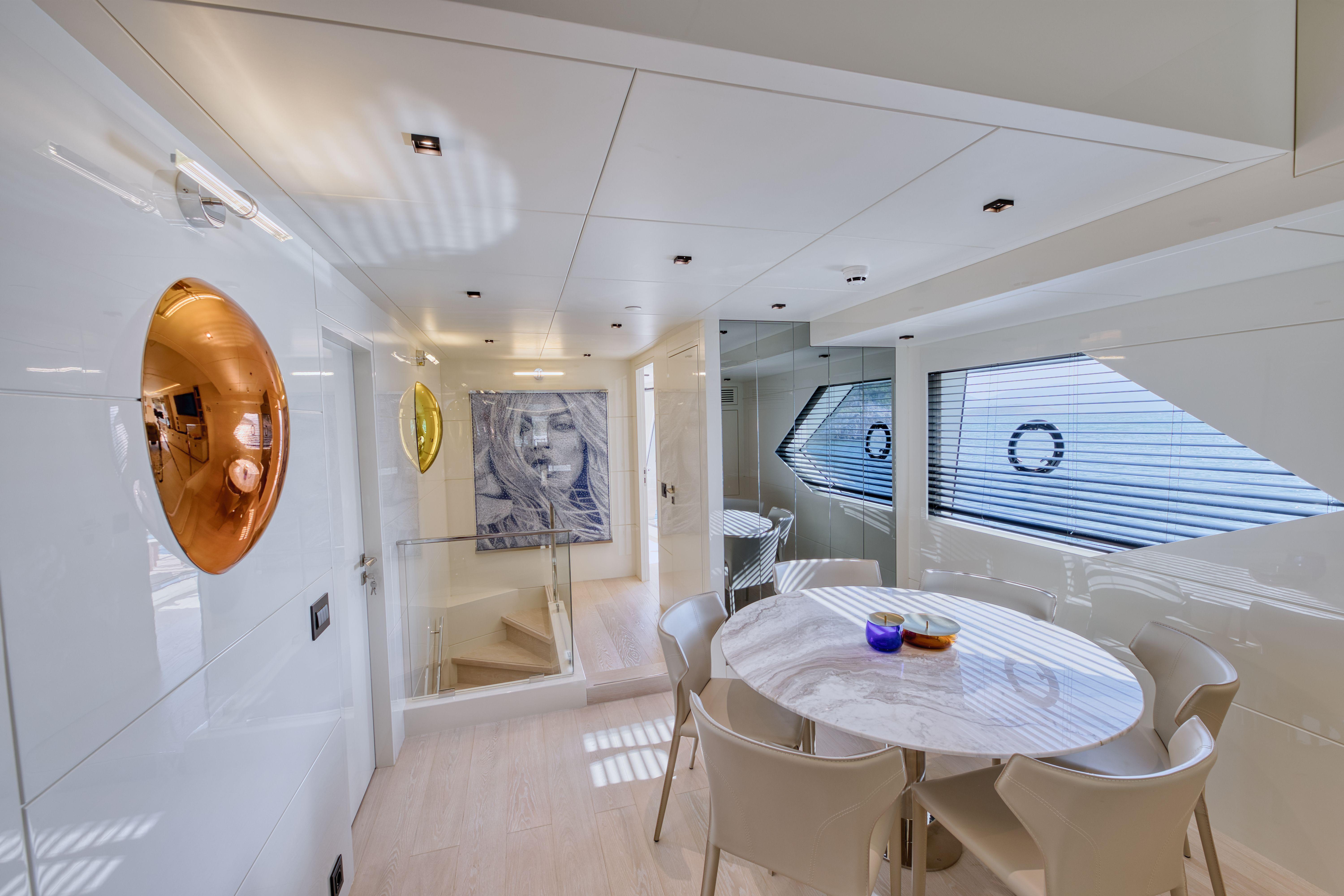 Luxurious Evadne ROCK X 2025 yacht interior with modern dining area and stylish decor.