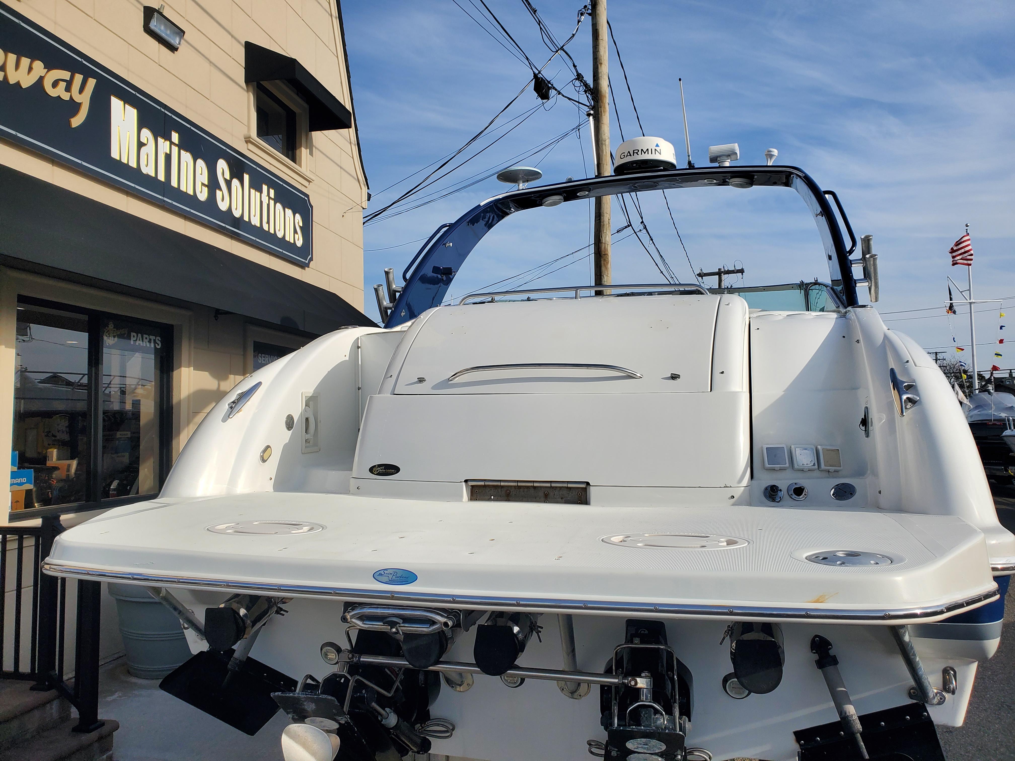 2004 Formula 370 Super Sport boat at a marine solutions dealership.
