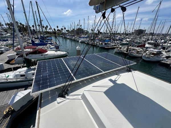 Solar panels on a 2021 Bali 4.8 yacht docked at a marina.