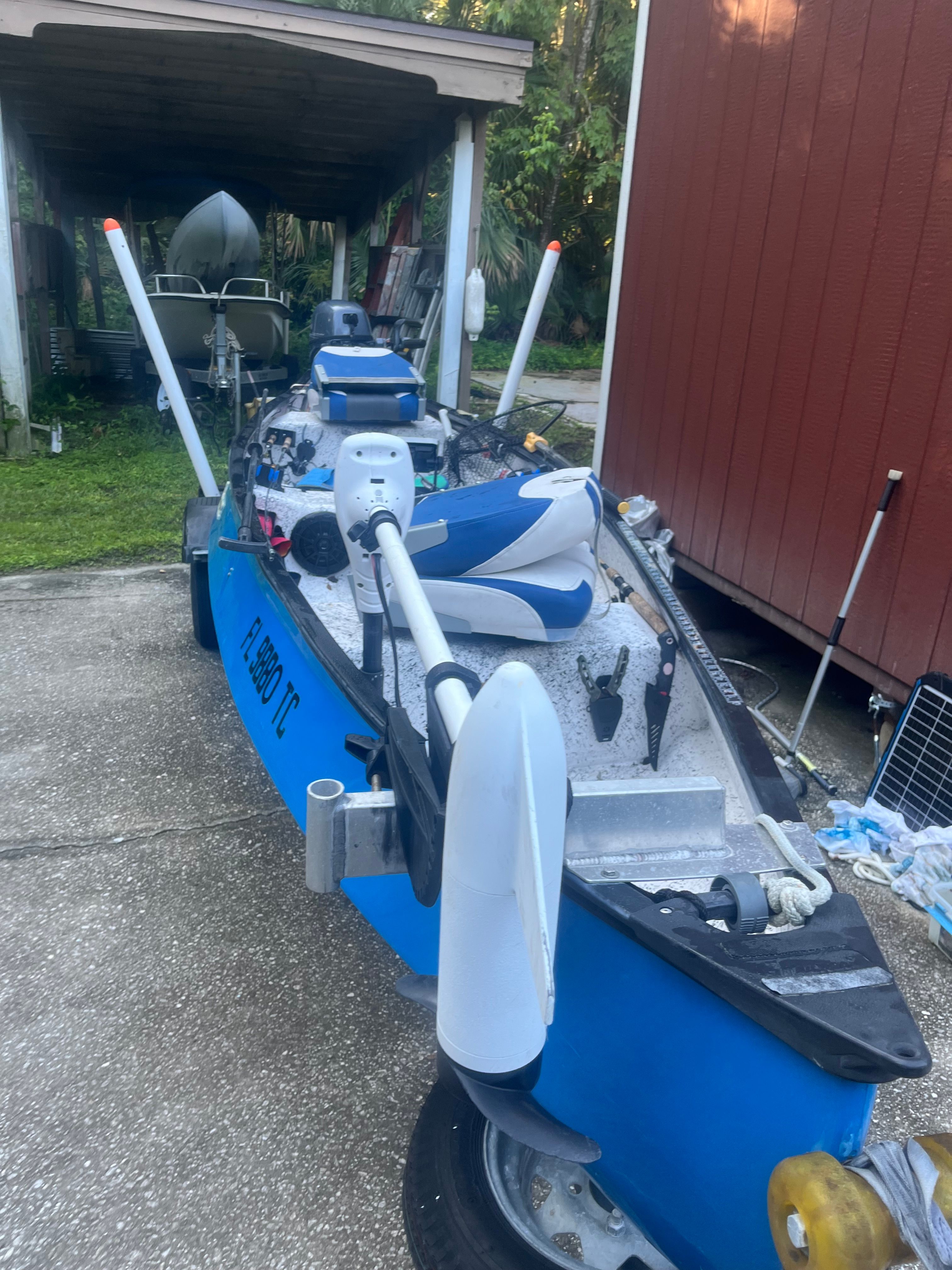 Blue Custom boat 15-4, year 2021, on a trailer.